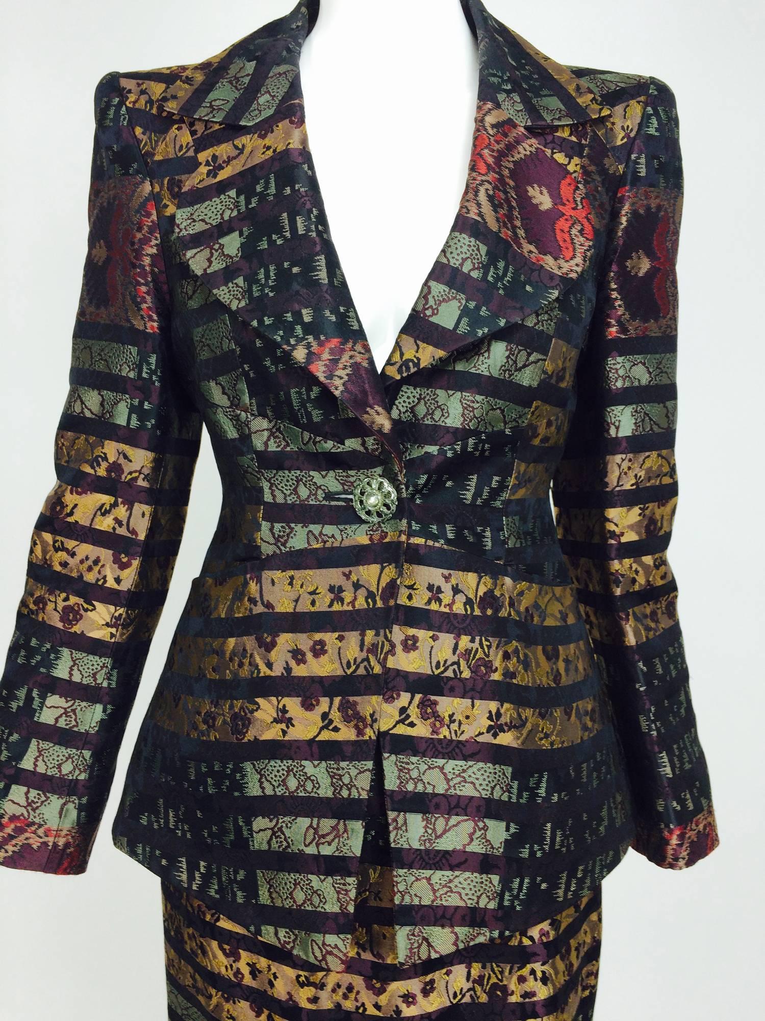 Vintage Christian LaCroix brocade suit 1990s...Single button closure, notched lapel, hip length jacket is fitted through the waist and flares to the hem, angled slash front pockets, long sleeves with button cuffs...Fully lined in a contrasting print