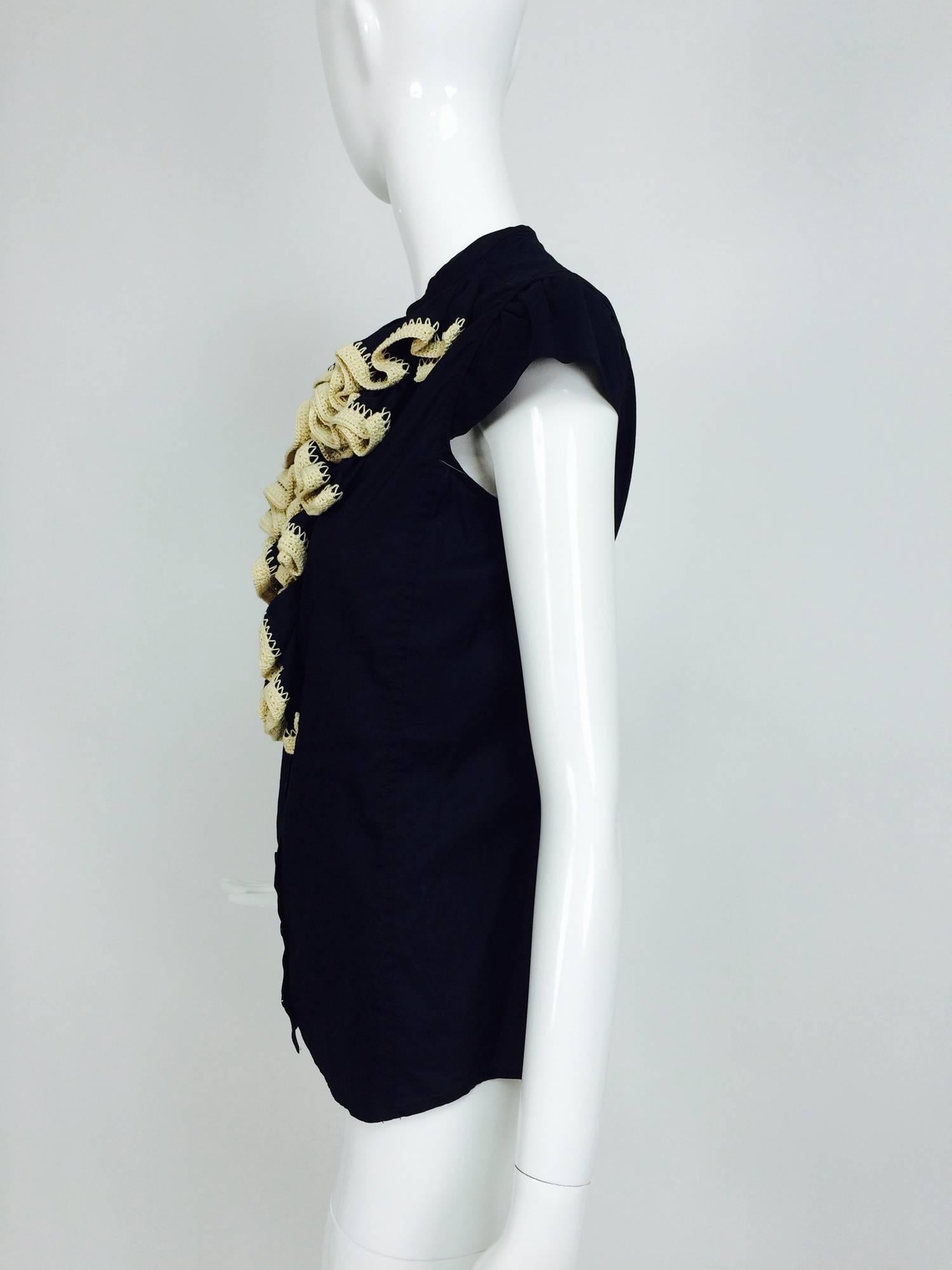 Yves Saint Laurent black polished cotton cap sleeve crochet ruffle front blouse...Silky cotton blouse with a banded collar, the bodice features rows of ruffles each trimmed with a band of ecru cotton crochet...Cap sleeves, button front and princess