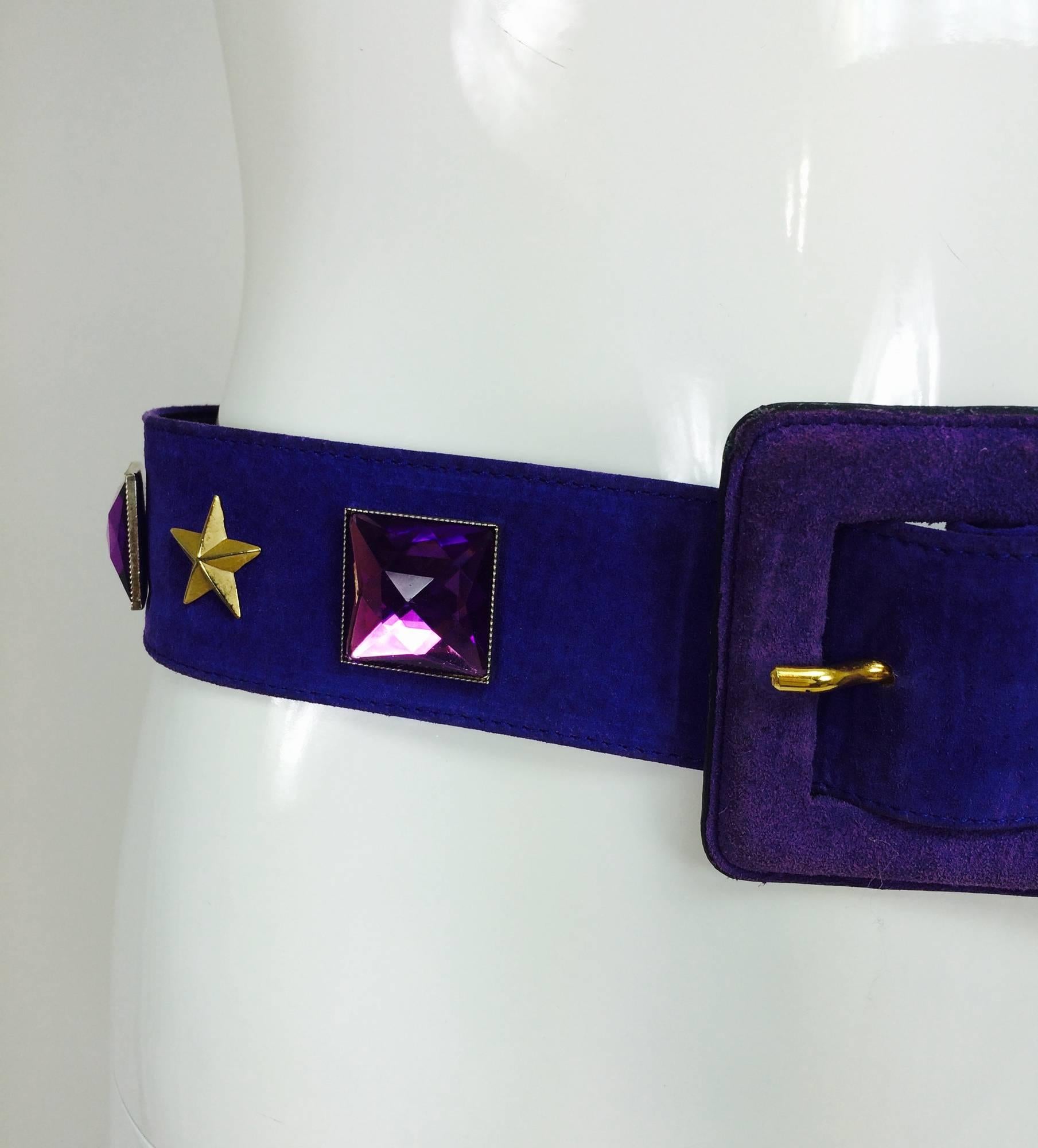 Vintage Yves St Laurent jeweled purple suede belt 1980s...Wide purple suede belt set with large purple stones, studs & stars, the end of the belt is covered in gold embossed leather...Lined in leather...In very good vintage