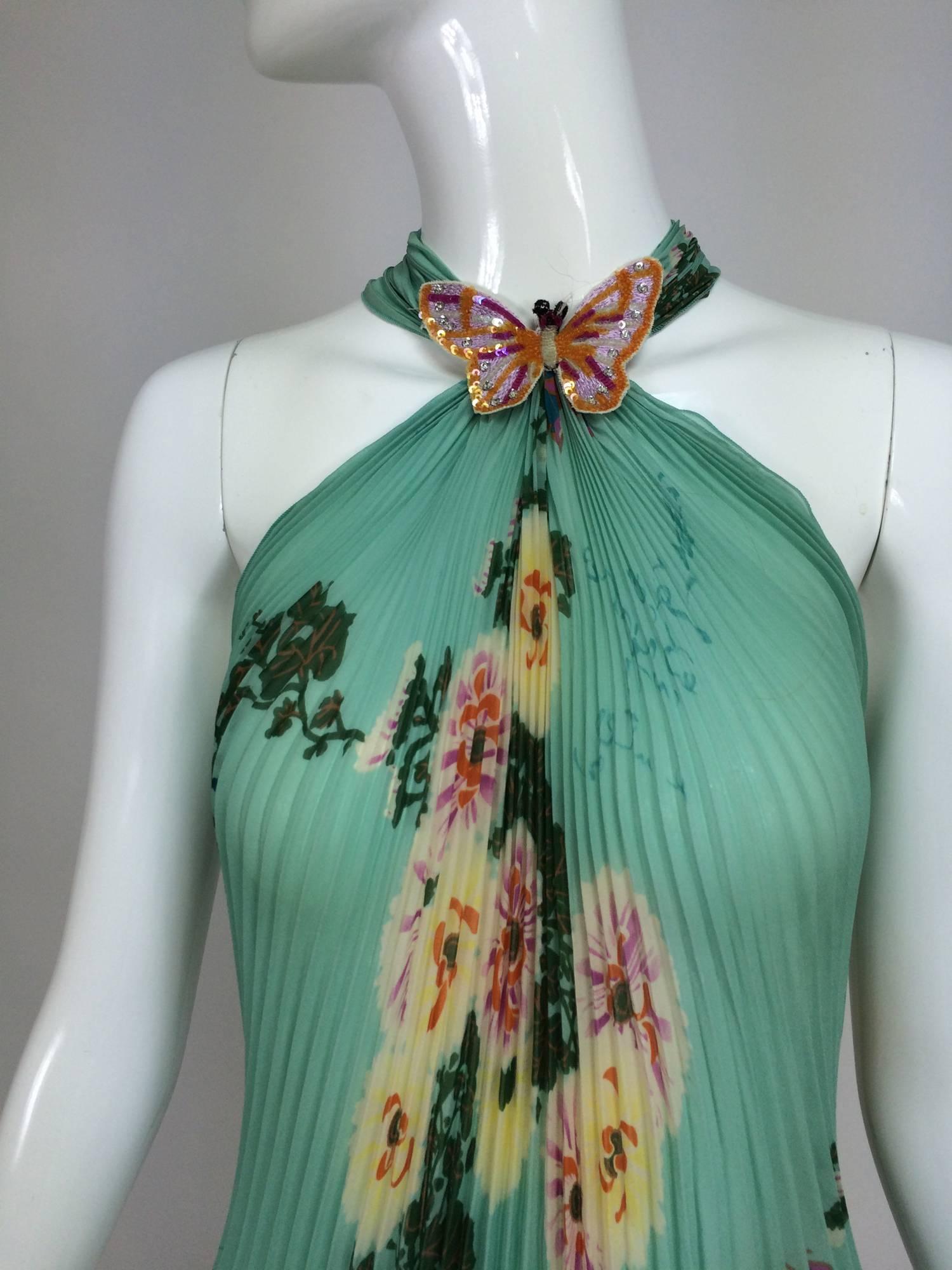 Ungaro aqua floral print pleated silk chiffon butterfly halter top...Pretty knife pleated floral print chiffon halter top has a sequin butterfly applique at the neck front, pulls on and has long pleated ties at the neck back...Unlined...Fits like a
