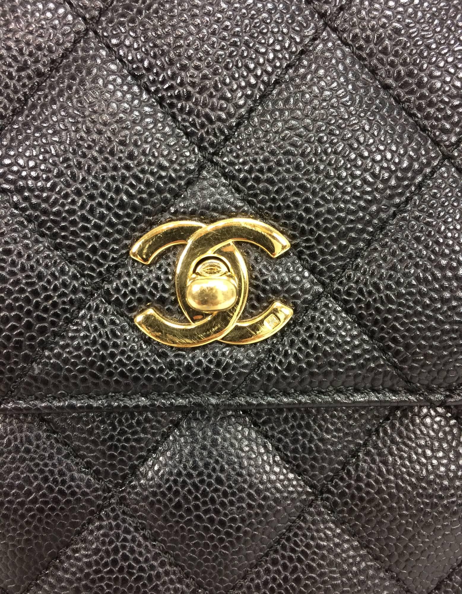 Women's Vintage Chanel top handle flap front black caviar leather handbag