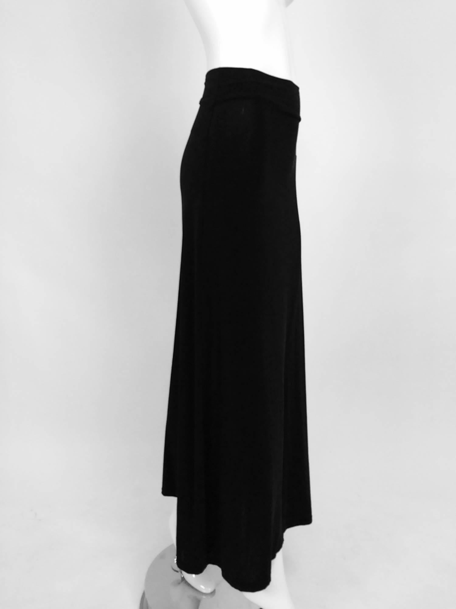Vintage Issey Miyake silky black stretch jersey fold over waist A line maxi skirt from the 1990s...Pull on skirt with a turn over waist...Fits like a size small...Unlined...Stretch fabric.

In excellent wearable condition... All our clothing is