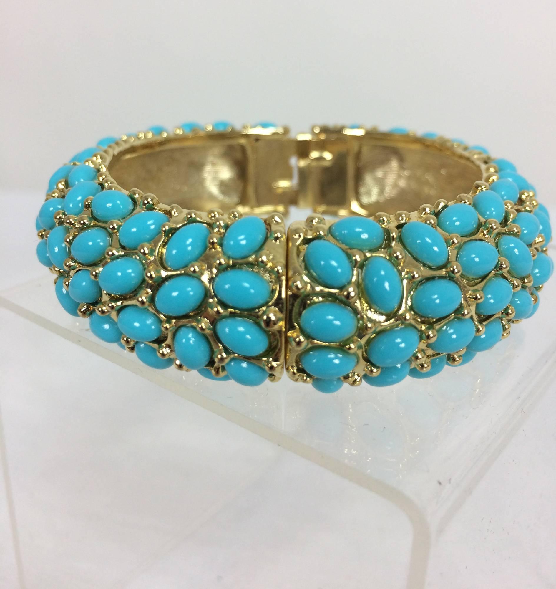 Kenneth Lane turquoise cabochon encrusted gold clamper bracelet. Approximately 3/4