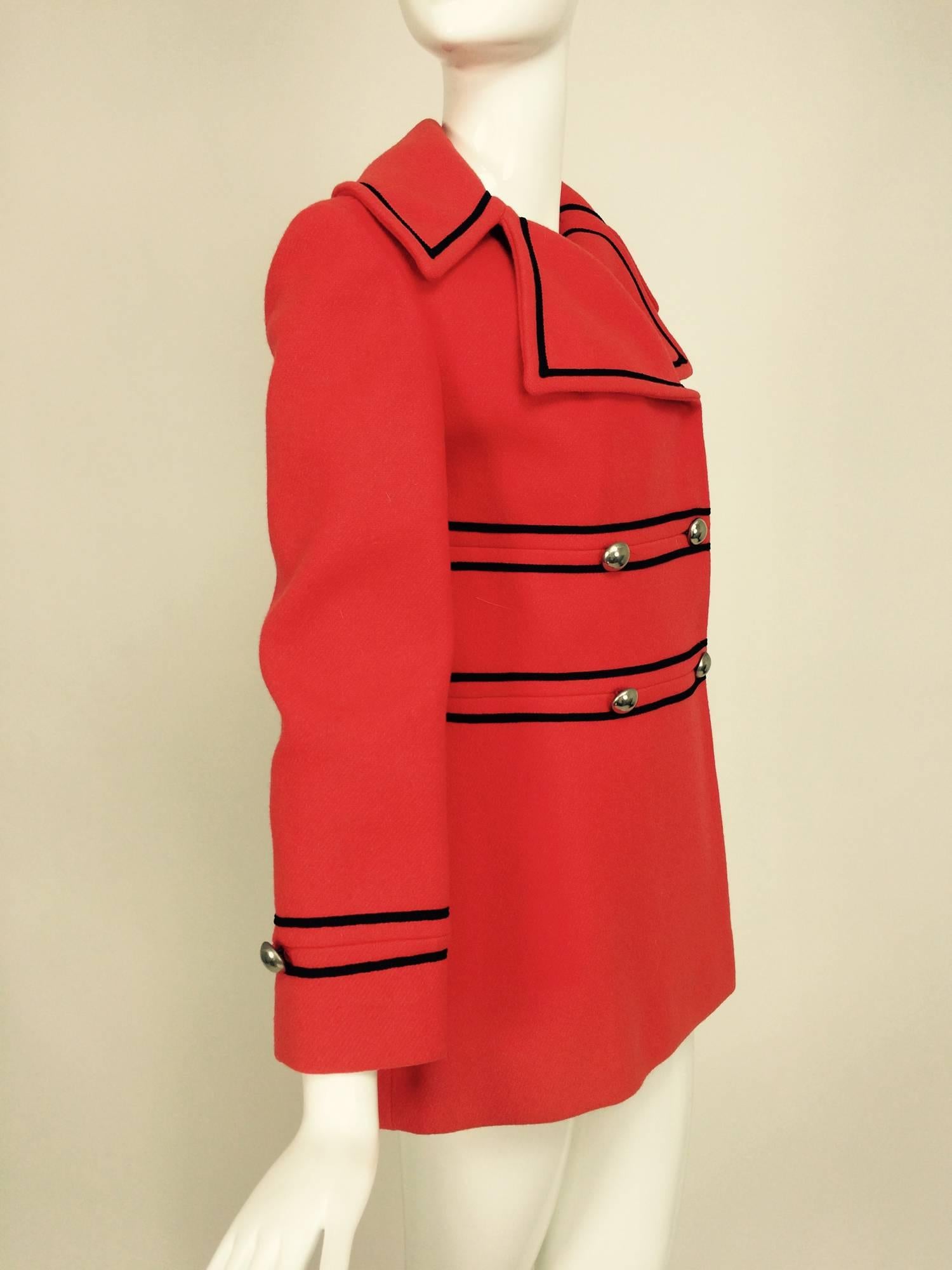 Tomato red wool military style pea coat Junior Gallery 1960s...Double breasted jacket with wide notched collar...Silver dome buttons and black cord trim...Fitted and flares just below the hip...Hidden covered snaps at the front....Fully lined in