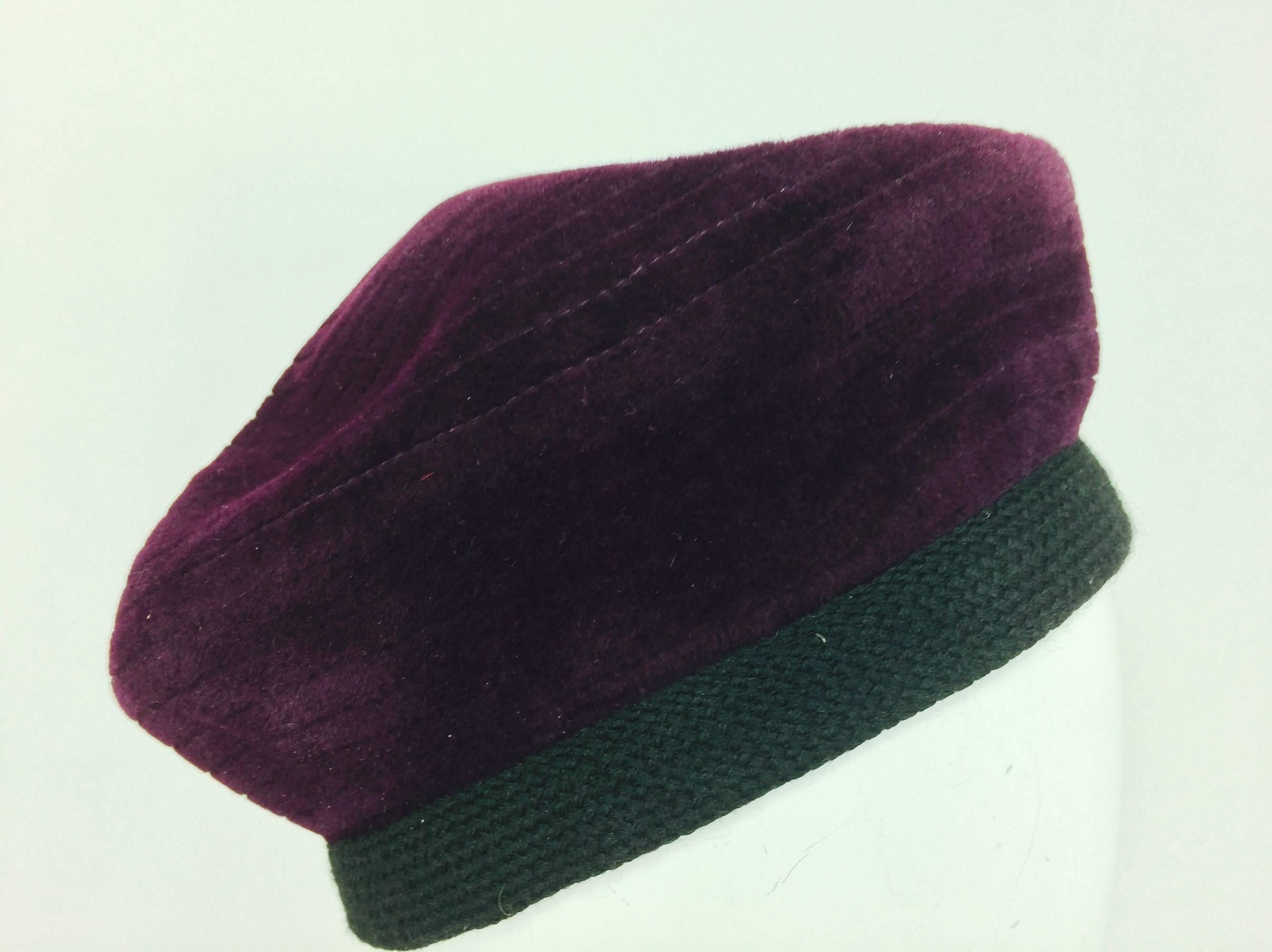 Givenchy aubergine velvet beret with feathers 1960s...Top stitched concentric circles at the crown...Head band of black braid band with pheasant feather applique at the side...Unlined & unworn, from the estate of Betsy Kaiser...Approximately 22 1/2