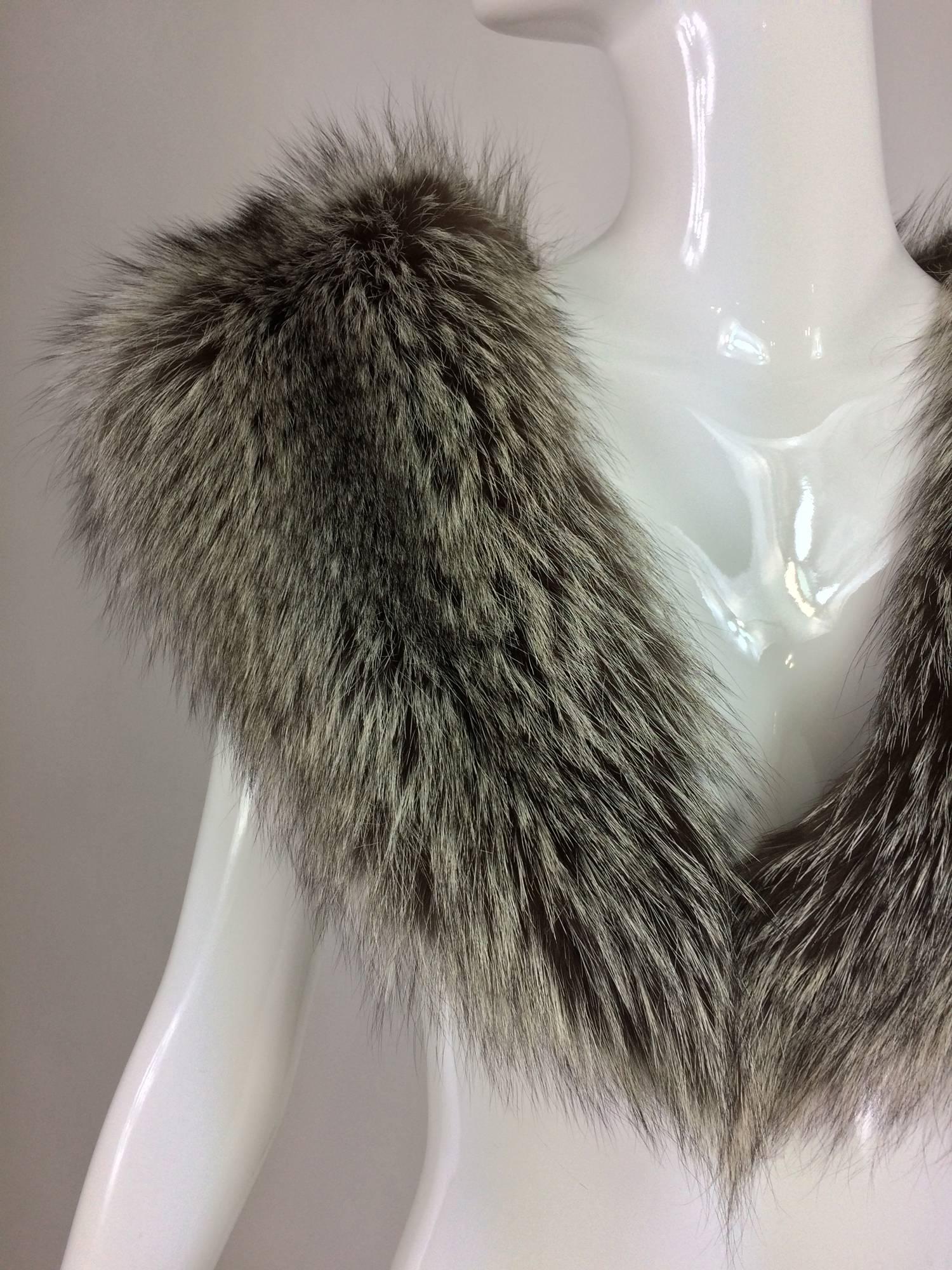 Silver fox fur draped shoulder wrap 1960s...Perfect evening wrap or luxurious addition to a winter coat...Full deep silver fox fur with silver tips and black underfur...From the 1960s...Lined in black velvet...Closes with a hook at the front