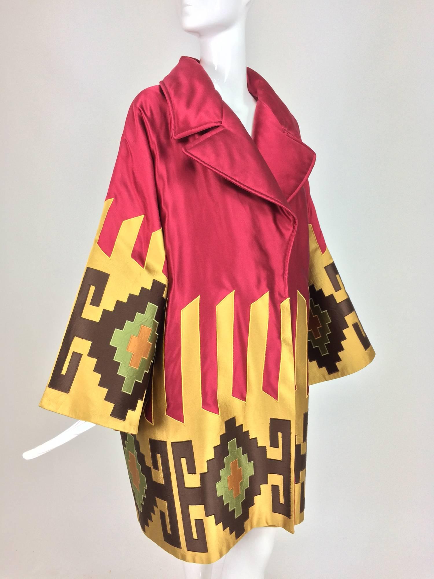 Valentino quilted silk applique kimono sleeve wrap coat 1980s...Geometric applique in gold, brown and green set against rich garnet silk...The coat is quilted inside and interlined for warmth, it is light and not bulky...Wide kimono sleeves...Full