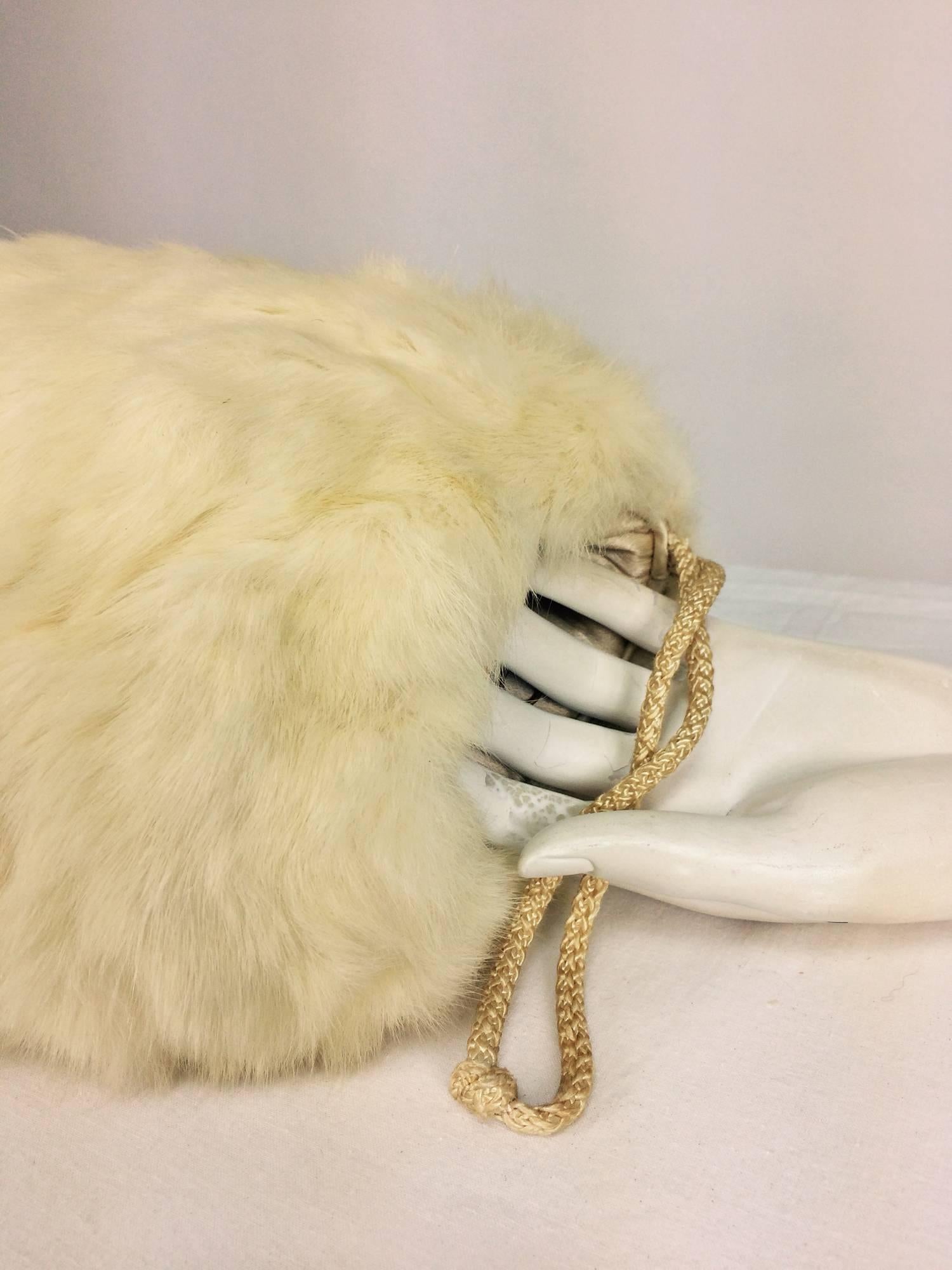 Ermine fur and down insulated muff hand warmer 1930s...Soft ermine fur round muff, open at each end and lined with silk, it is insulated with down to keep your hands nice and warm...There is a hidden zipper compartment inside to keep your