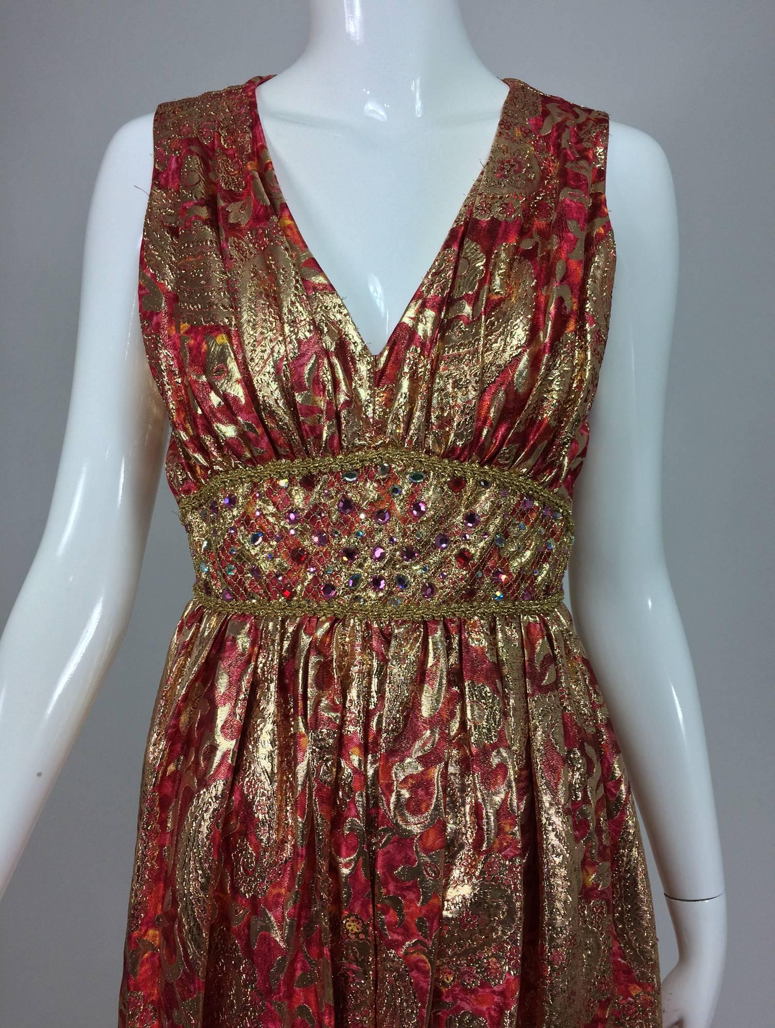 Malcolm Starr jeweled coral and gold metallic lame harem jumpsuit 1970s...This is an amazing piece and one to make an entrance in! Plunge neckline jumpsuit has a fitted waist that is decorated with jewels and gold net at the front...The legs are