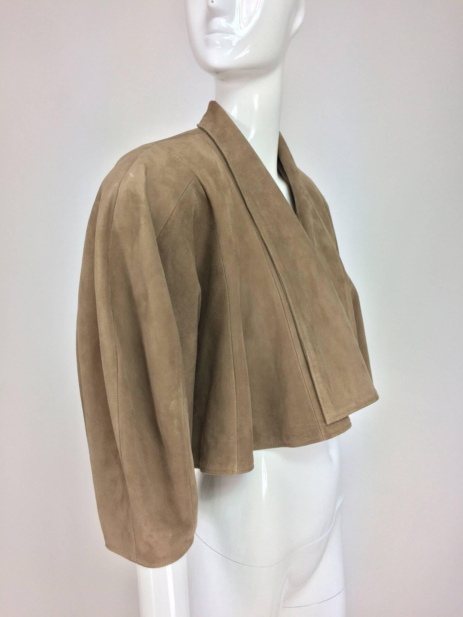 Jean-Claude Jitrois taupe suede cropped swing jacket 1980s...Buttery soft taupe suede jacket has wide turn back lapels and is open at the front, cropped to the waist (depending on your height)...The shoulder are softly, but definitely padded,in that