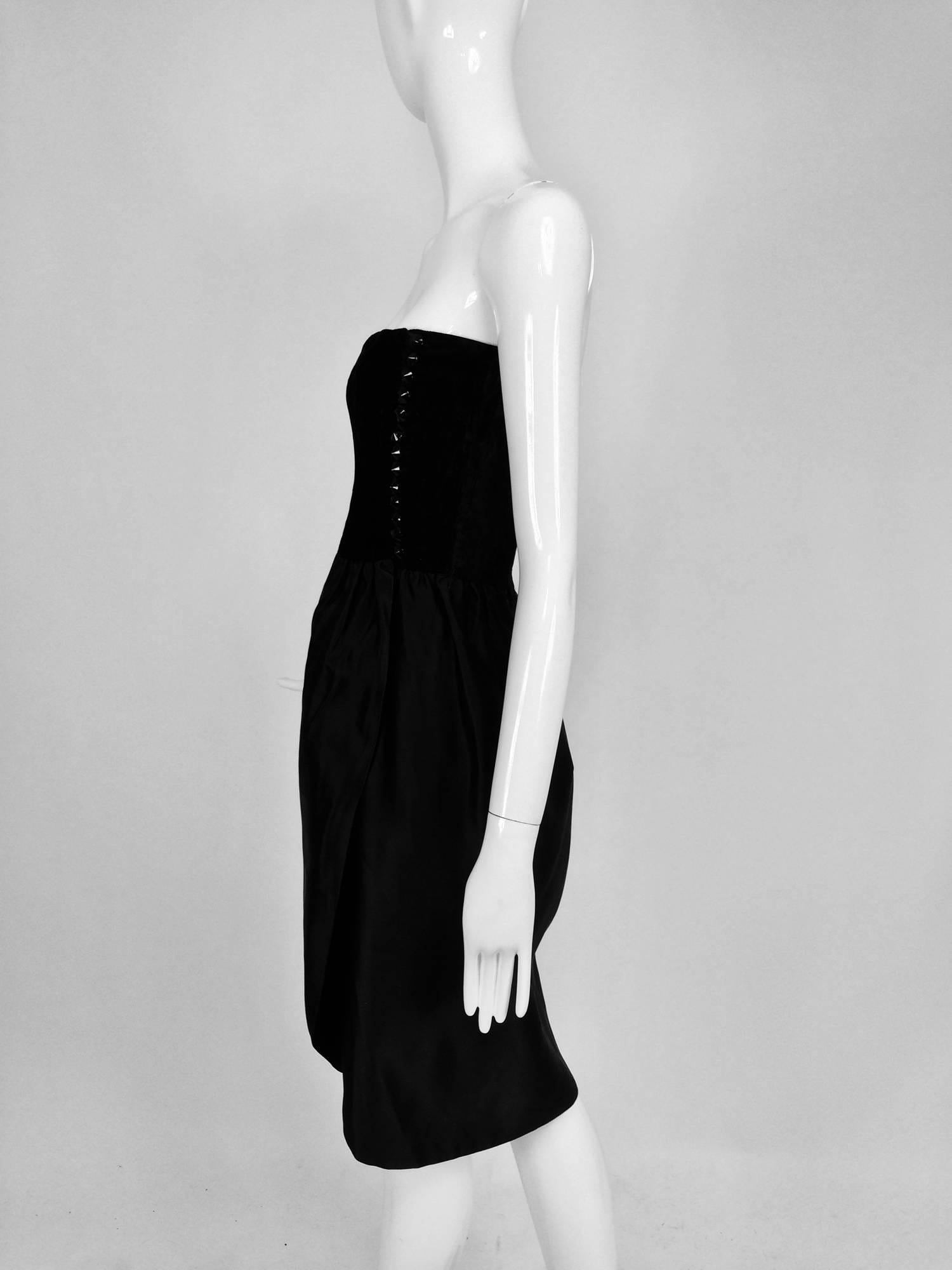 Lanvin numbered Haute Couture cocktail dress...From the late 1970s or early 1980s...Strapless, black crushed silk velvet bodice dress, closes at the side with cone shaped glossy black buttons and hand made loops, the bodice is boned and fully lined