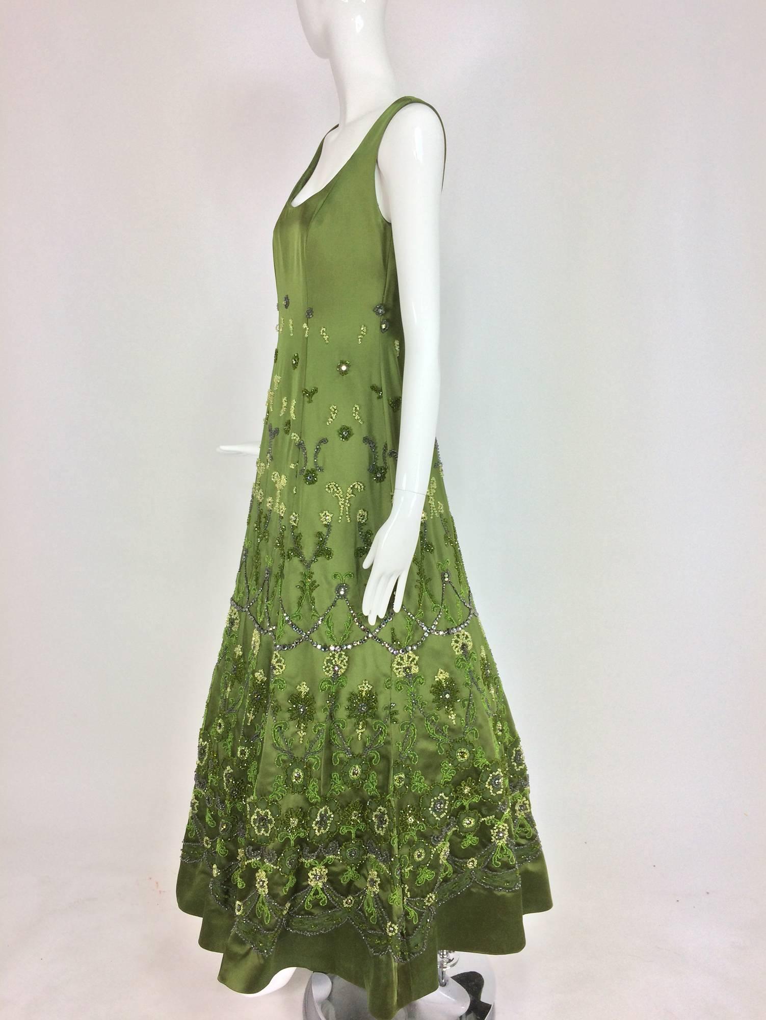 Randi Rahm green silk heavily hand beaded and rhinestone evening dress. A beautiful one of a kind evening dress in forest green heavy silk, heavily hand beaded with sparkling crystal beads and prong set rhinestones. This would make a lovely mother