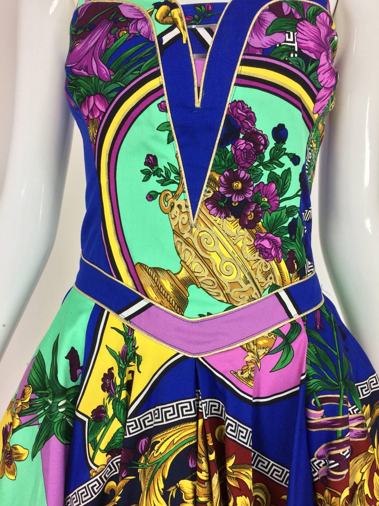 Versace Jeans Couture strapless full skirt cotton print mini dress 1990s...Fitted bodice dress has a full flared short skirt the hem is trimmed in a pleated band of gold lame, the skirt has an electric blue tulle under slip...Vibrant cotton
