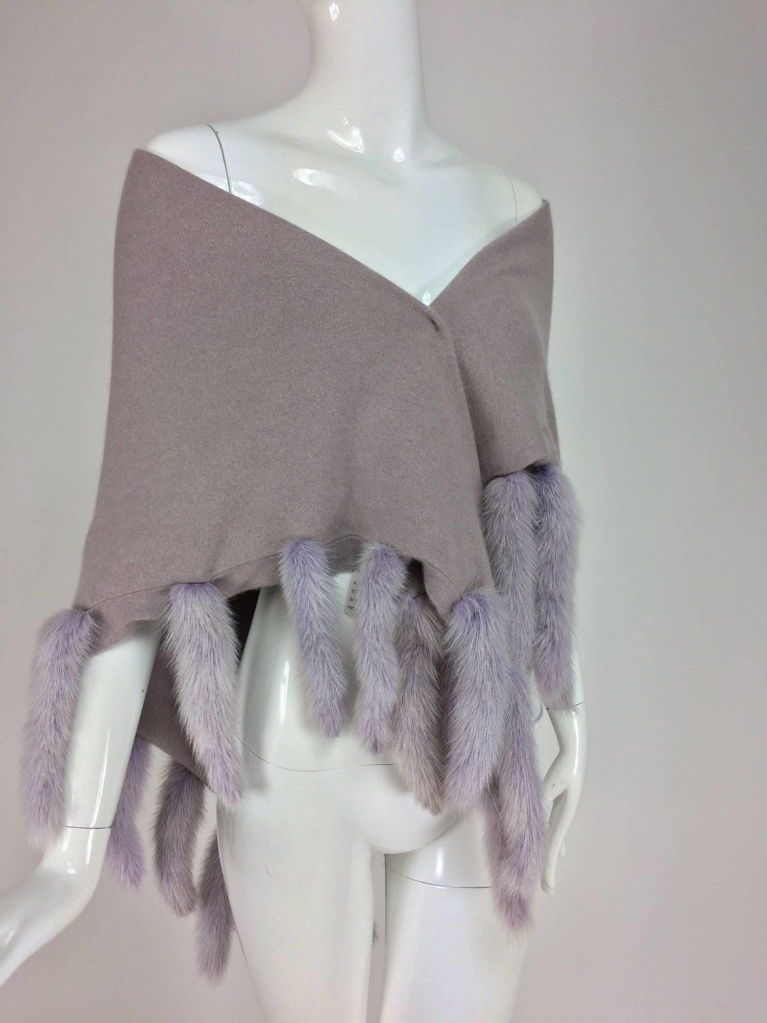 Lavender soft wool and angora knit shawl with mink tails...Triangular shawl is double thickness, it is trimmed on 3 sides with mink tails, the knit shawl is pale lavender and the mink tails are a coordinating shade of lavender...In very good