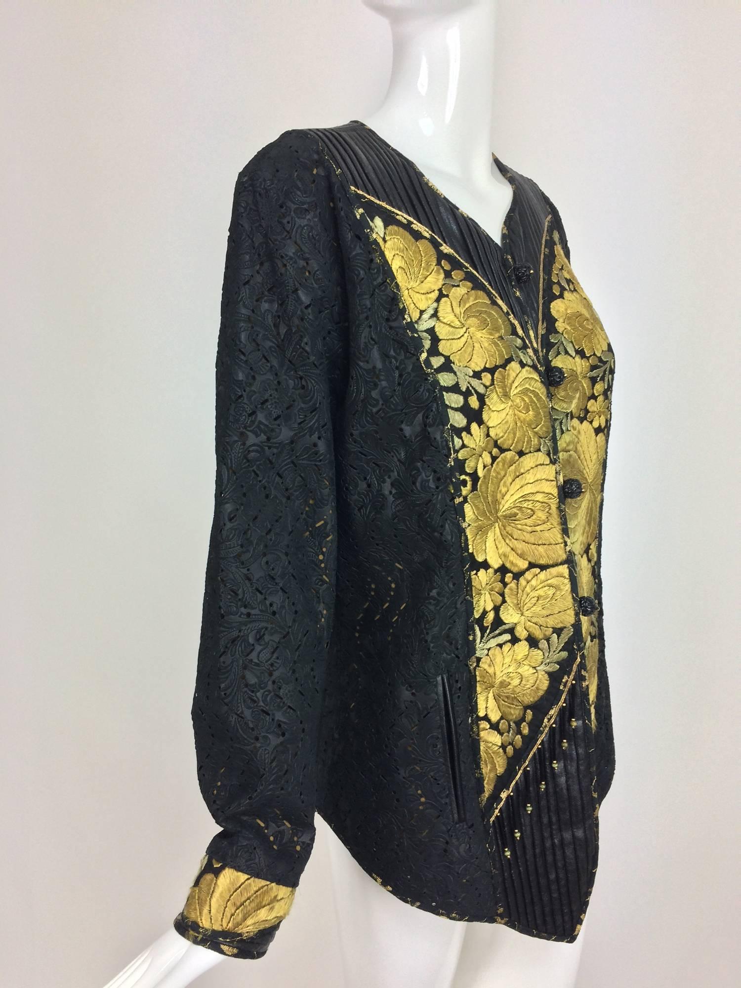 Kaneko Los Angeles, art to wear black laser cut leather jacket with panels of embroidered antique textile in gold...Beautiful design one of a kind jacket with lots of unusual details...The laser cut leather is amazing...Bands of inset panels of hand