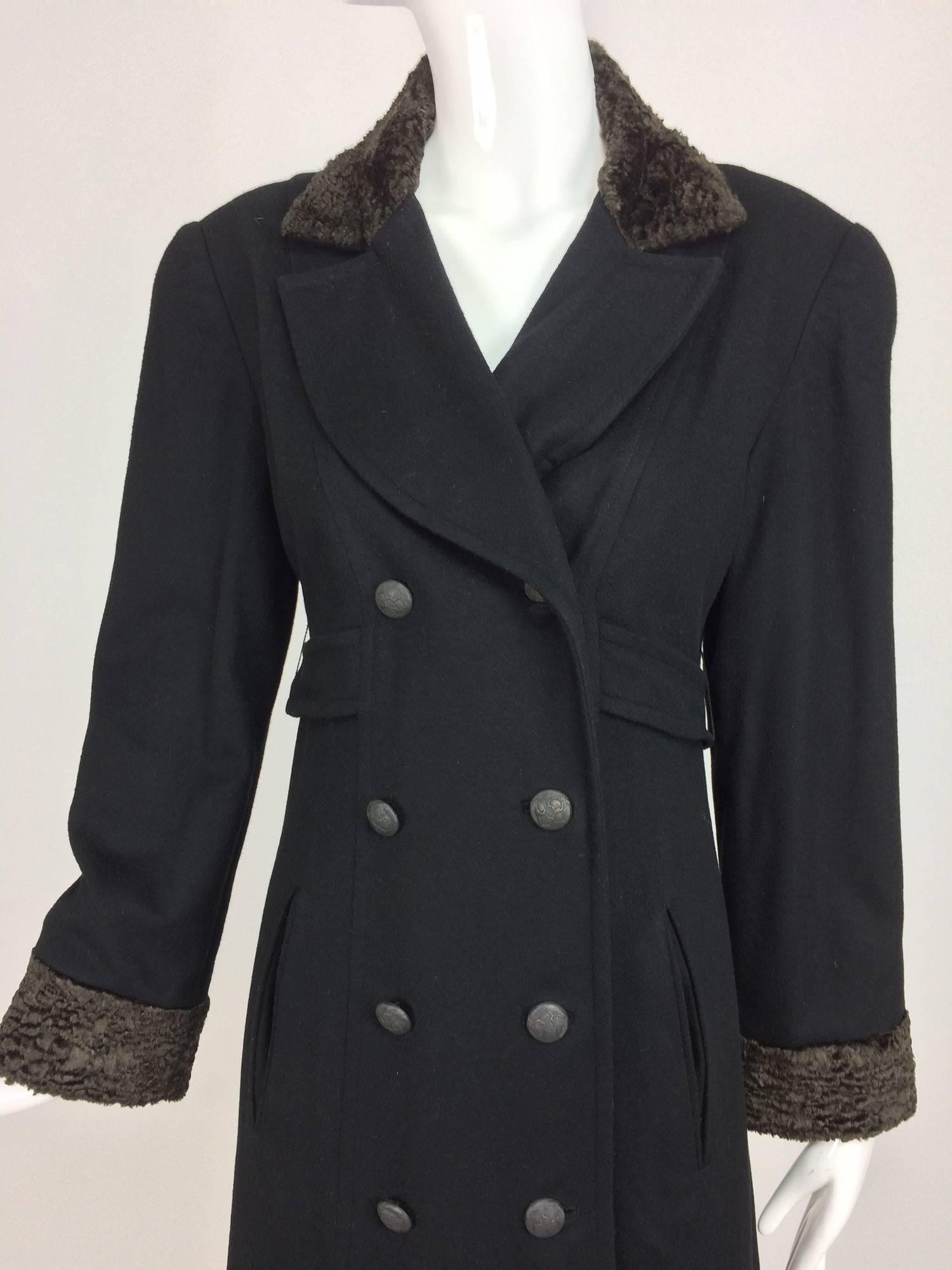 Vintage Zelda Military inspired double breasted black 100% cashmere coat...Soft black cashmere coat has curved lapels, faux fur collar and cuffs, double breasted closes with decorative metal buttons...Figure defining 1/2 belt at the waist...Fully