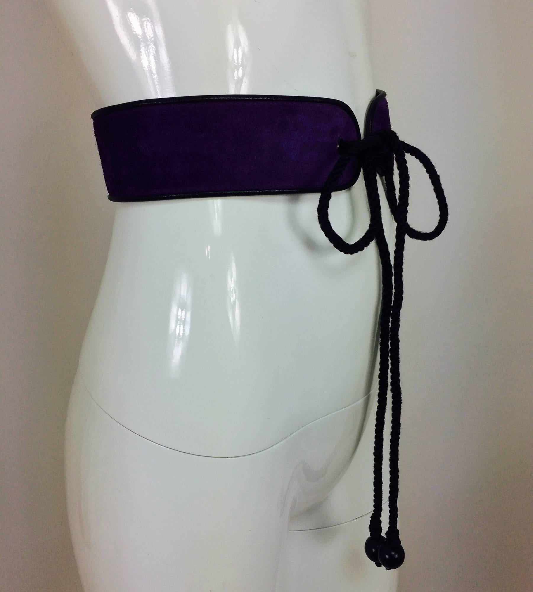 Vintage Yves Saint Laurent purple suede & leather cord tie belt 1960s...Purple suede with black leather trim waist belt with black cord ties that have a single wooden bead at each end...Marked size  A, Small...In excellent vintage