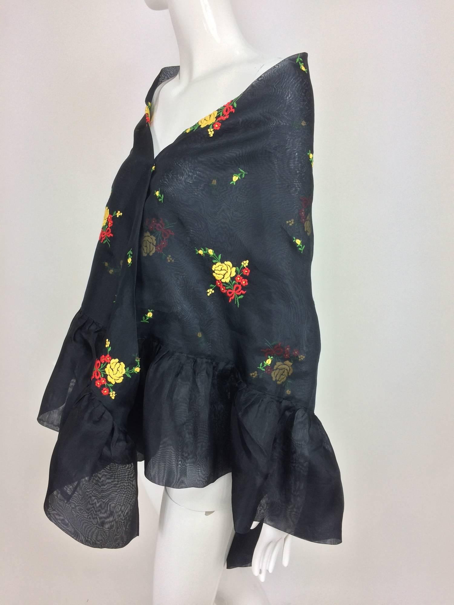 Vintage Christian Dior floral embroidered black silk organza ruffle edge shawl 1970s...Triangle shawl with two ruffle edge sides and one long plain edge...Embroidered all over with pretty yellow, red and green flower bouquets...Looks