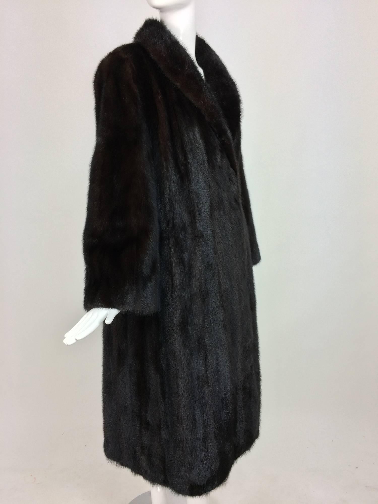 Dark glossy shawl collar full length mink coat France...This beautiful coat was purchased in France, it was made to order...Shawl collar coat closes at the front with fur hooks (hidden)...Long sleeves are full at the wrist...Hand warmer