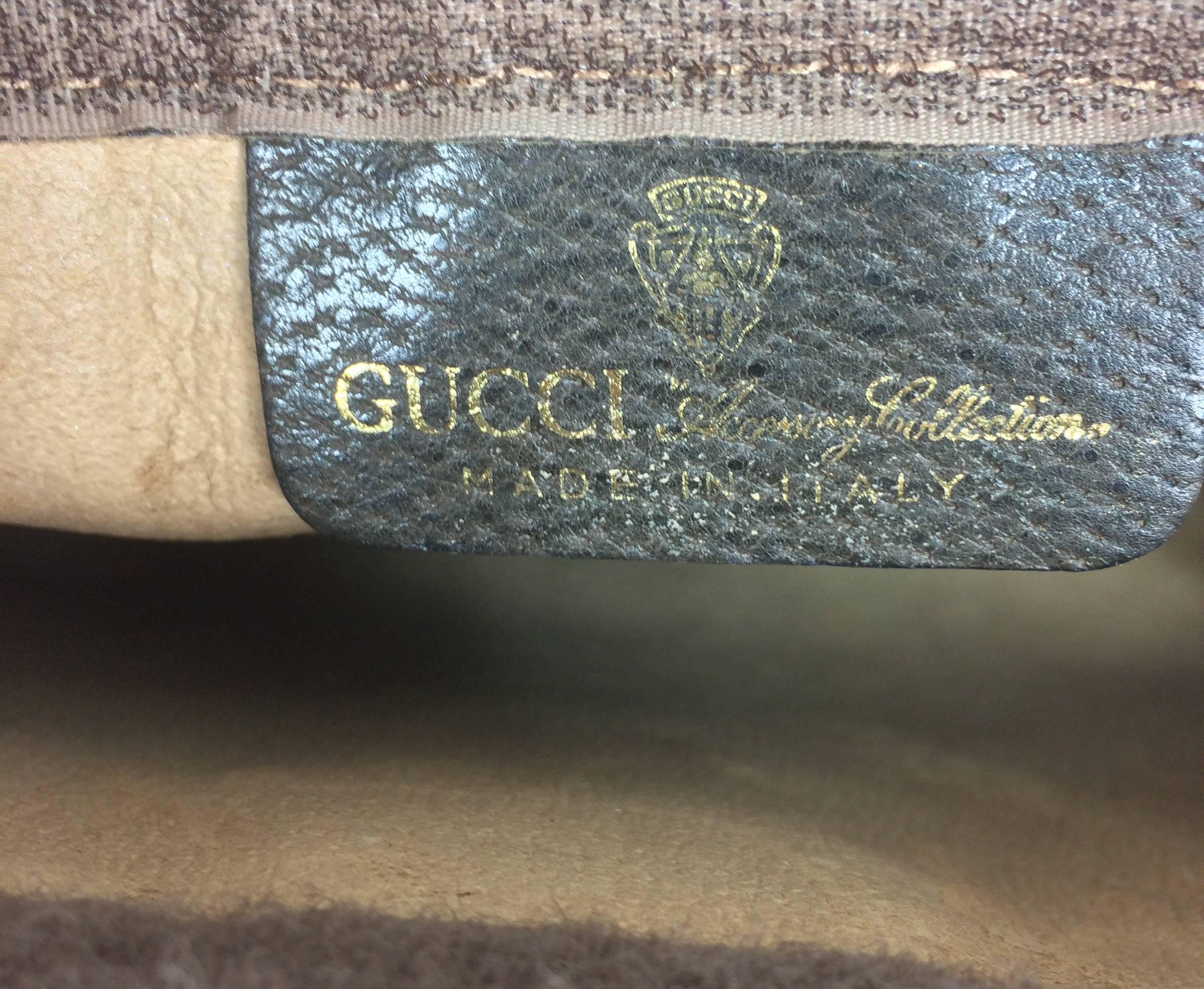 Vintage Gucci Accessories Collection cosmetics clutch bag 1970s...Great for cosmetics or use as a clutch...logo canvas with leather trim and green and red woven braid trim...Lined in leather...Closes with a Velcro band (hidden.)
Measurements are: