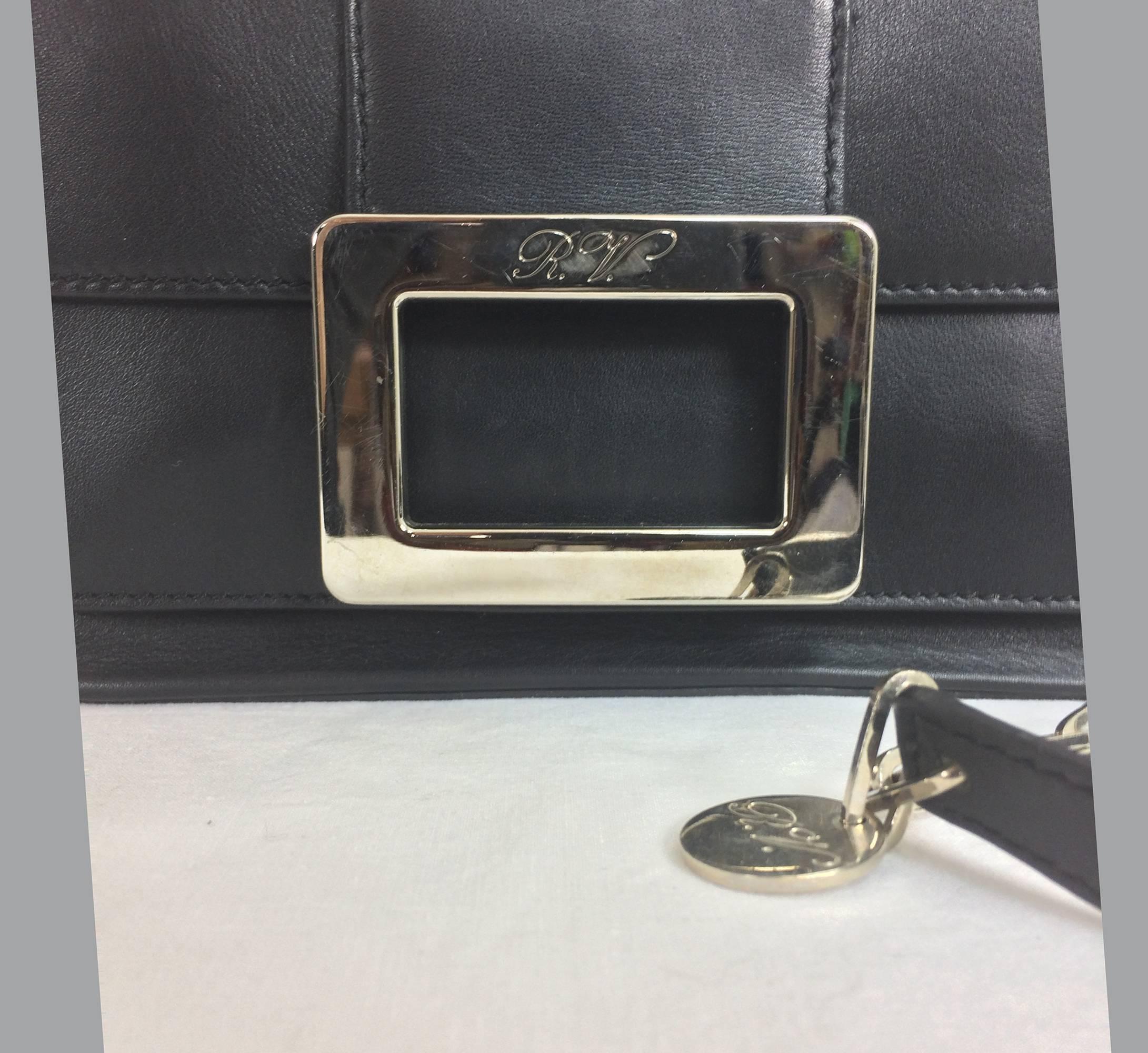 Roger Vivier black flap front leather shoulder bag with silver hardware...Beautiful black leather shoulder bag with a flap close front there is an open compartment under the flap, silver buckle with engraved RW...Silver chain (adjustable) and