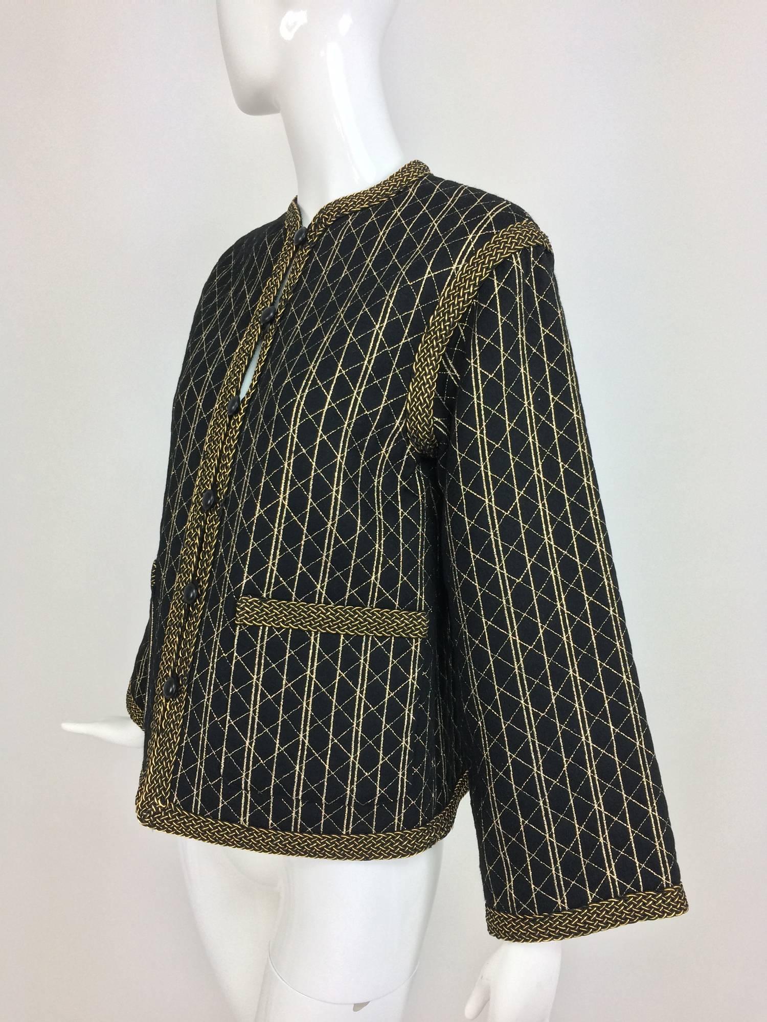 Vintage Yves Saint Laurent black & gold metallic stripe jacket 1970s...Round neck jacket with long sleeves, facings, shoulder seams and pocket tops are trimmed with braided gold metallic cord...The jacket closes at the front with button and