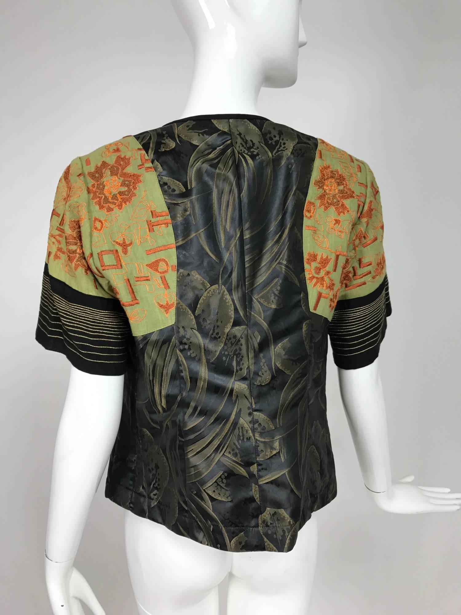 Dries Van Noten mixed fabric embroidered short sleeve jacket 40...Button front jacket of silky jacquard fabric, the shoulders have set in pieces of coral embroidered green linen, the sleeve ends are horizontally embroidered stripes...Jacket closes