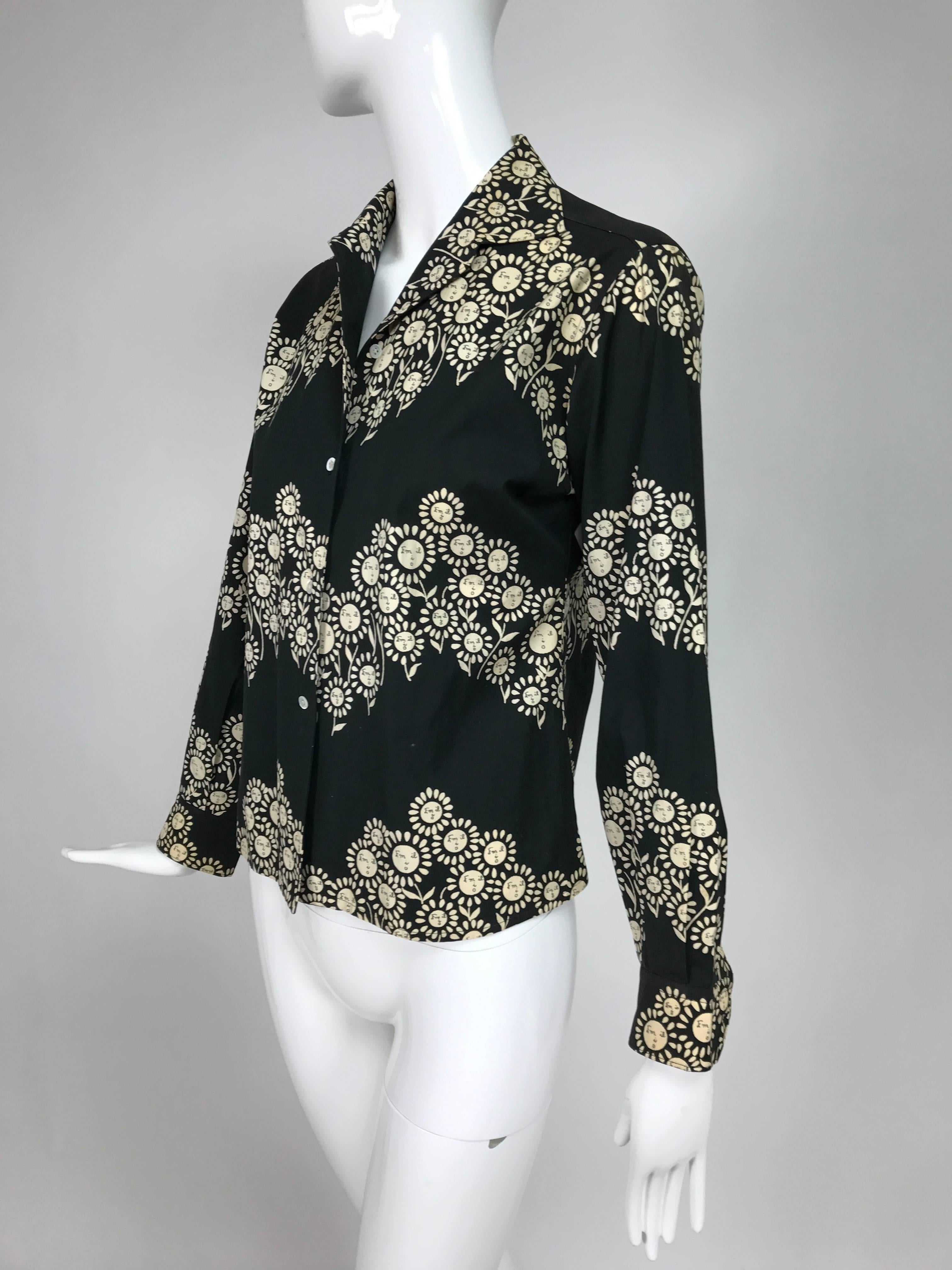 Rare vntage Emilio Pucci black and white cotton floral blouse 1950s...Button front black cotton blouse with a very unusual print in white, looks like a daisy, but the Emilio signature looks like a face...Long sleeves with button cuffs, button front