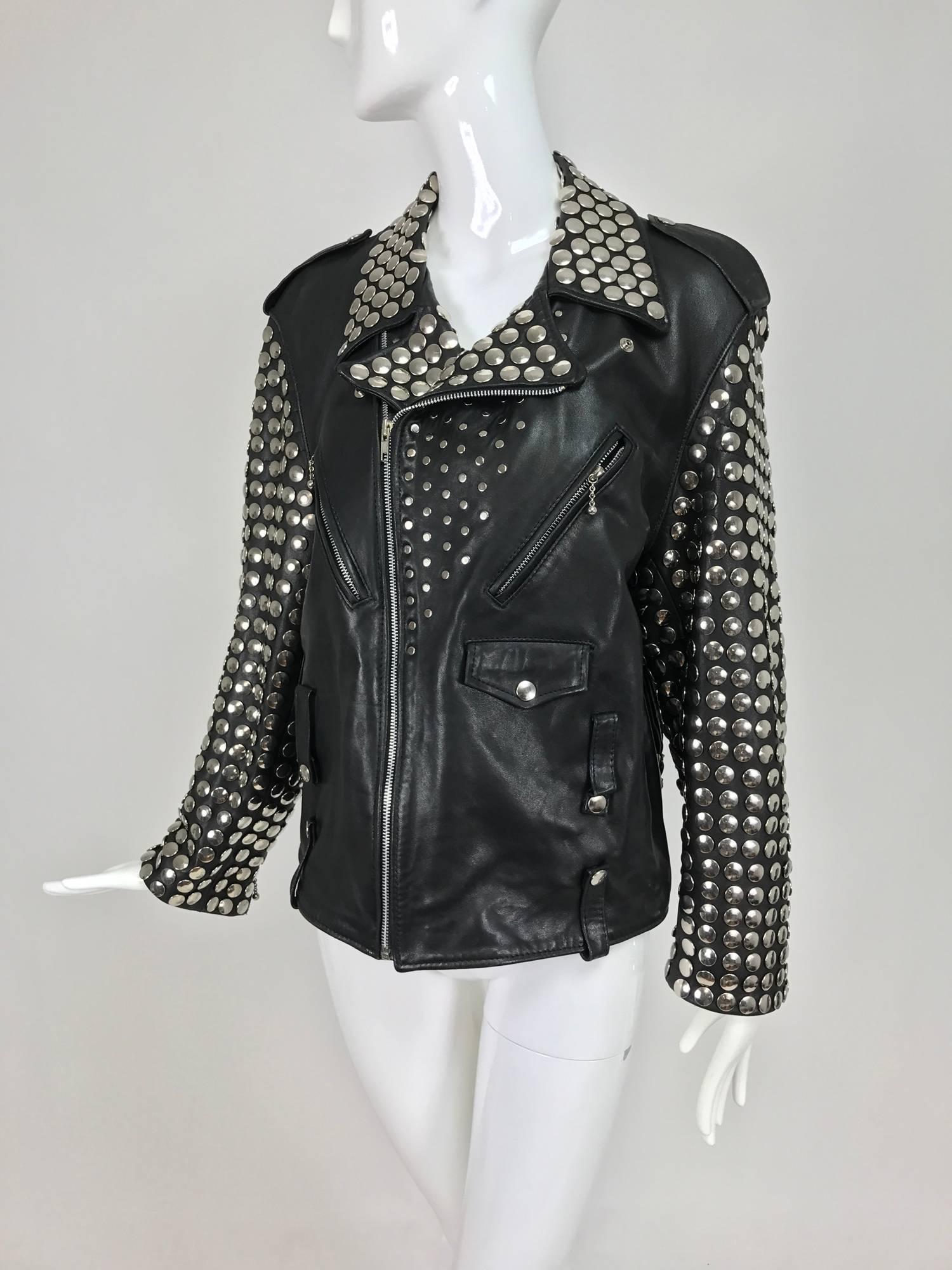 Vintage heavily studded black leather motorcycle jacket mens small...Buttery soft black leather jacket has sleeves and collar that are set with large silver metal studs...The jacket closes to the front side with a heavy silver zipper...angled zipper