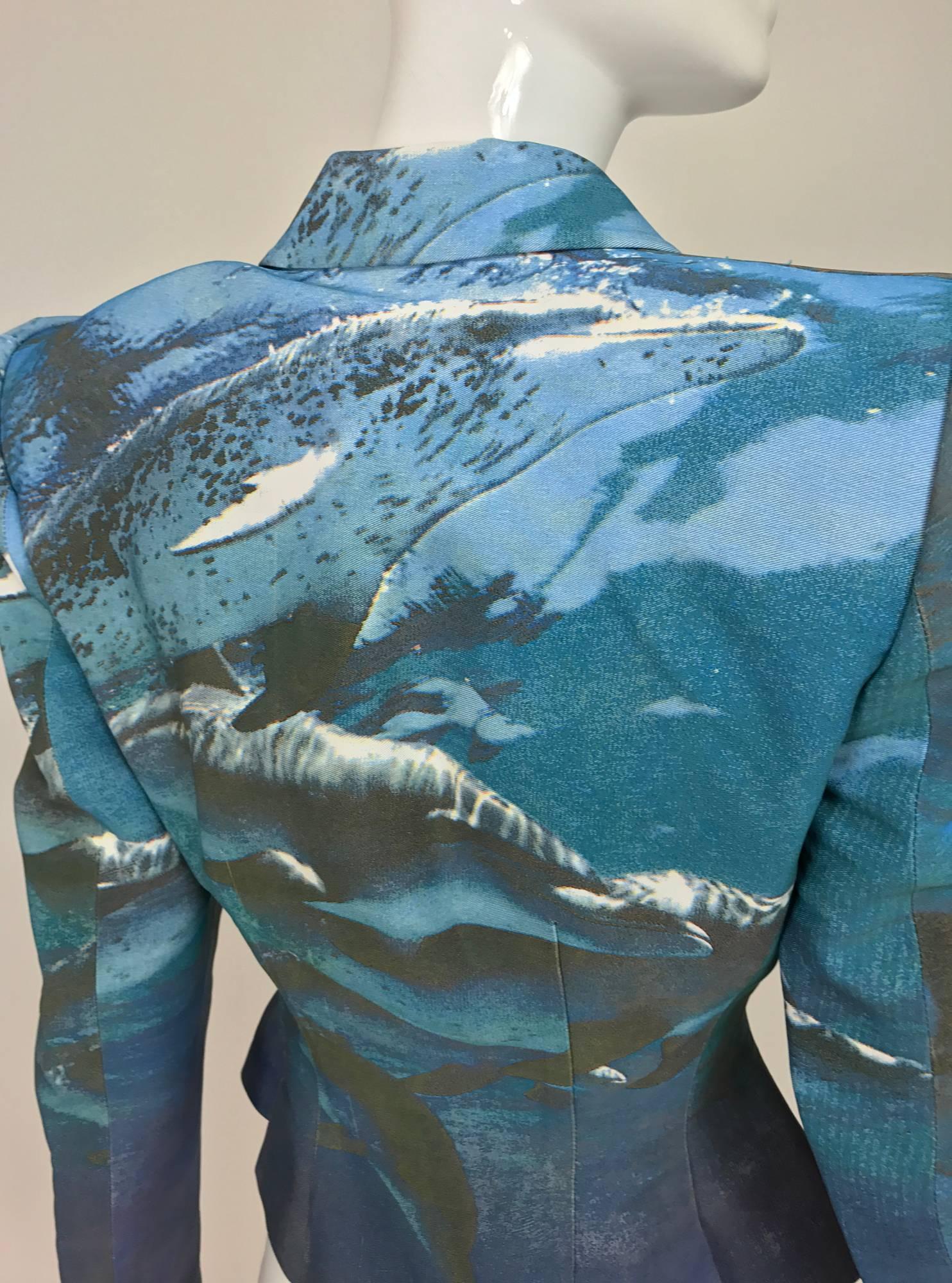 Alexander McQueen digital print underwater dolphin cropped jacket...Peaked shoulder cropped jacket, with nipped waist, double breasted, flared hem, long tapered sleeves with 4 button cuffs...Marked size 40

In excellent wearable condition... All our