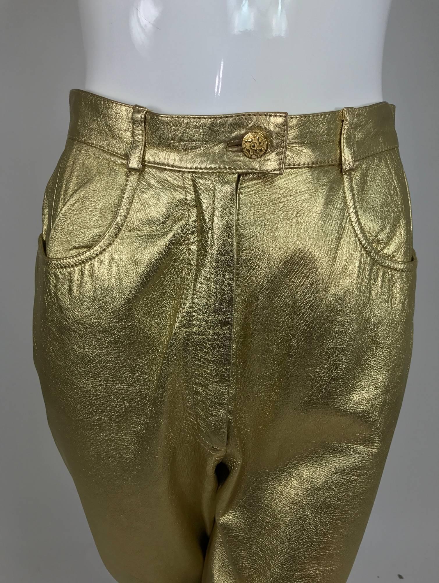 Ferragamo soft gold leather jeans style trousers from the 1980s...Fly front with button waist and scoop front pockets, yoke back there are no back pockets...Bright gold leather, these trousers sit at the natural waist and are fitted through the hip,