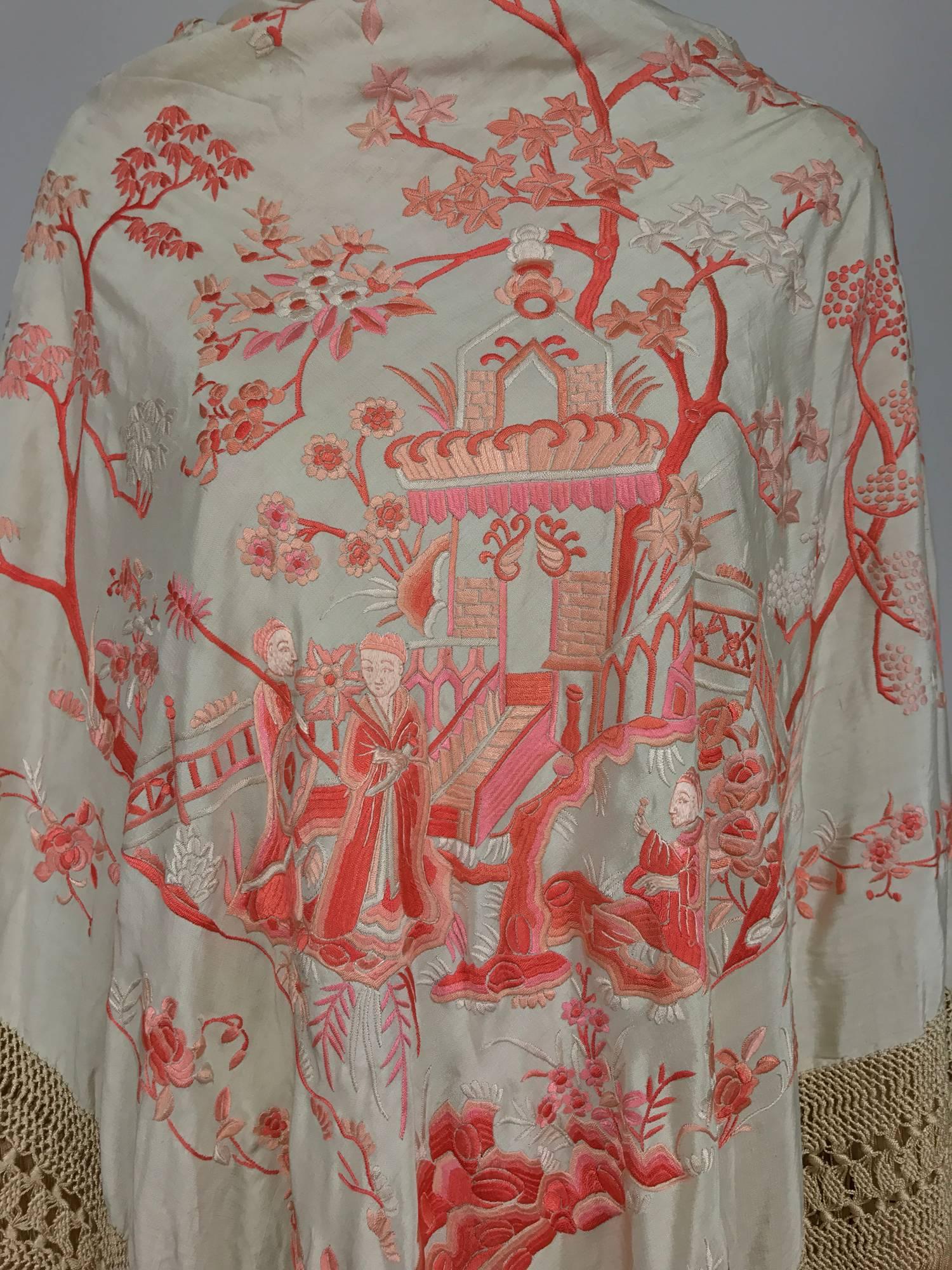 1920s Canton silk embroidered shawl in shaded coral embroidery on a cream silk ground...This amazing and rare colour way shawl features scenes of court life in China...Satin stitch embroidery...In excellent condition... 

53