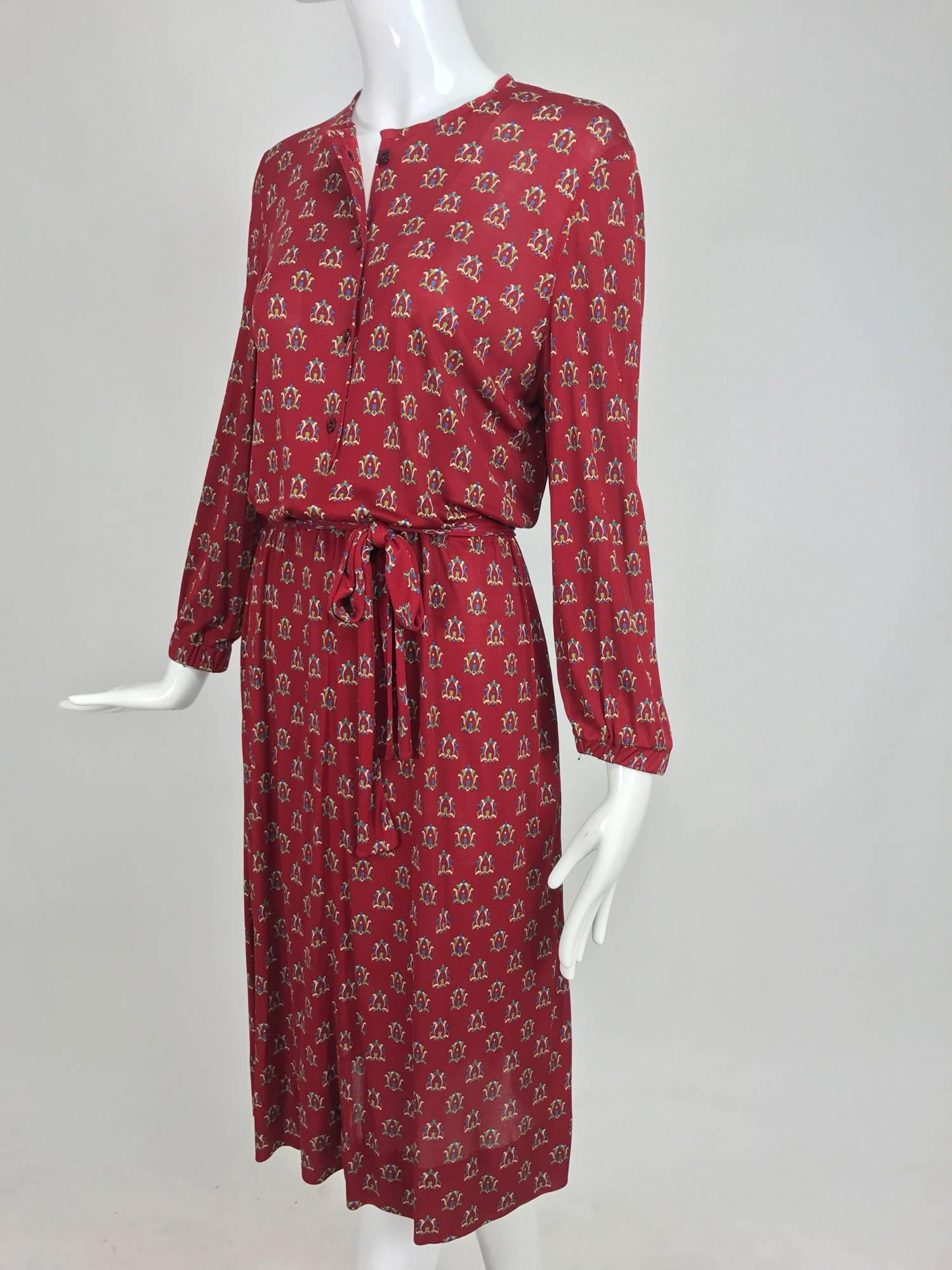 Vintage Celine fine wine silk knit print button front dress and belt 1970s...A great dress to travel with!  Round neckline, button front dress has long sleeves with cased elastic cuffs...Cased elastic waist and slightly flared skirt...Unlined fine