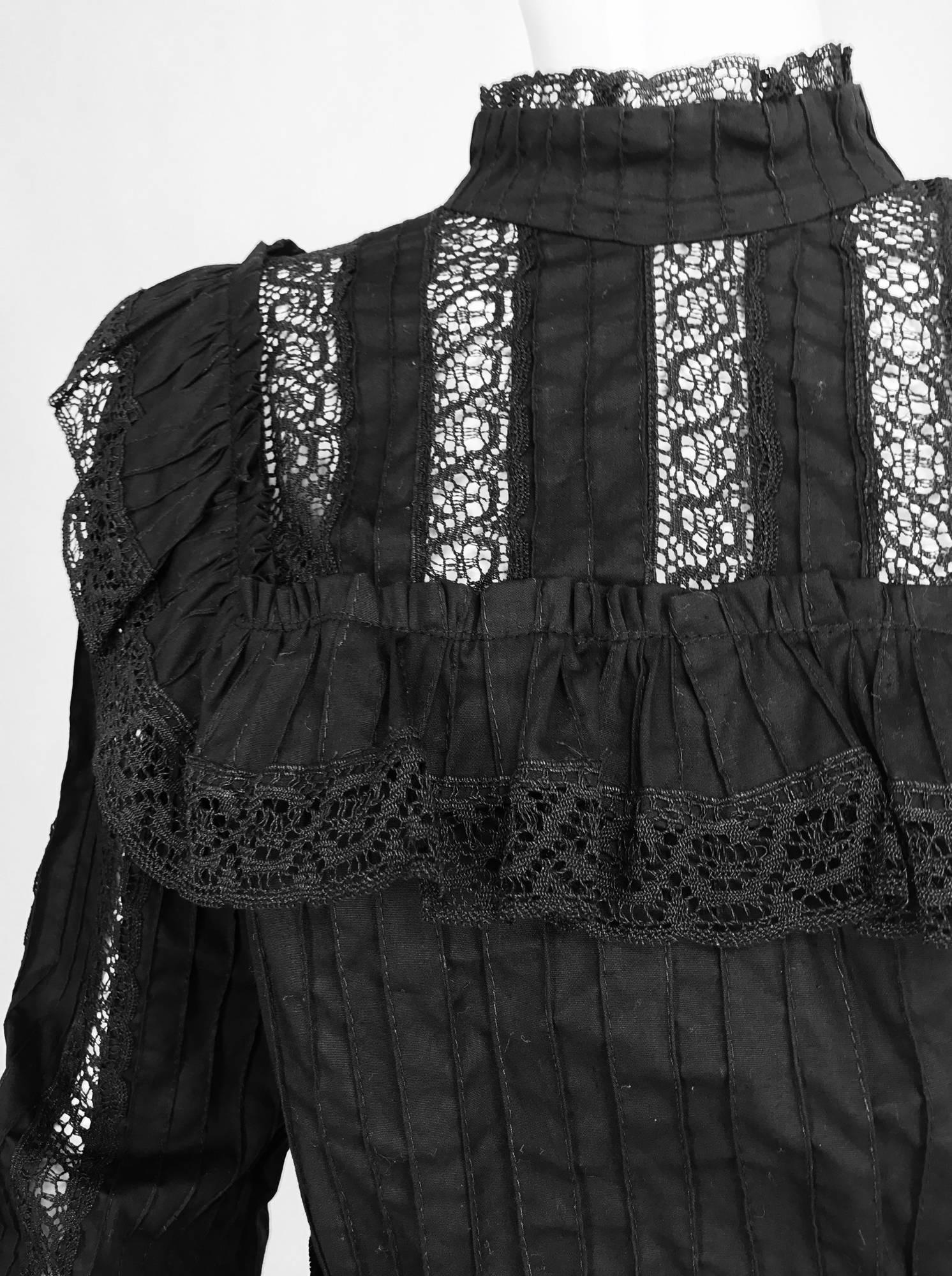 VIntage Victorian style black cotton and lace 2pc top and skirt 1960s...Made in Mexico, the top has a high collar with pin tucks and lace trim, the blouse is made of pin tucked cotton with lace trimmed set in yoke at the front and back, it is ruffle