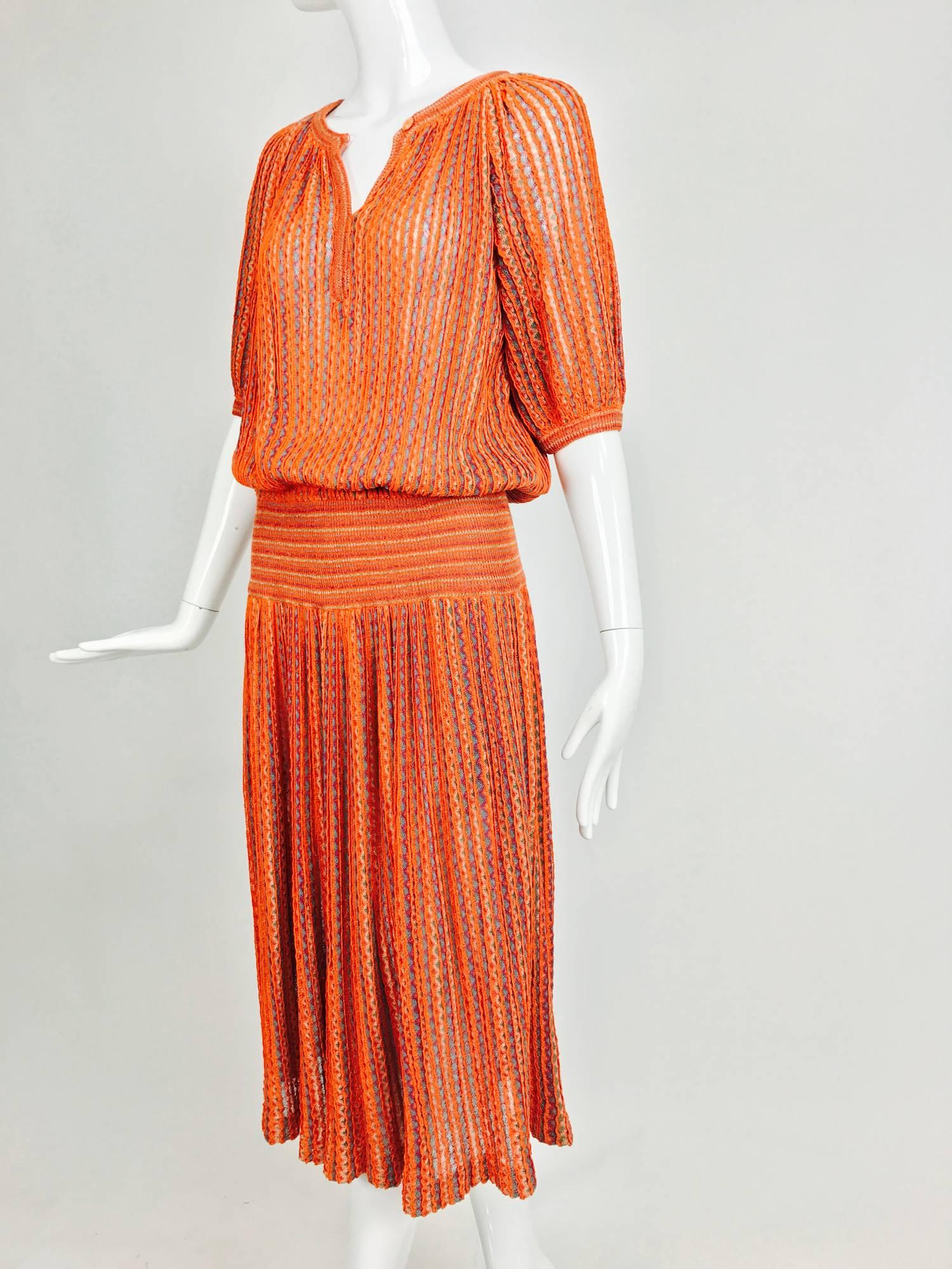 From the 1970s, I love the style of this Missoni dress and the variegated threads of coral, pale pin and green add depth and dimension to the knit, which is woven vertically...Pull on dress has a banded neckline and placket front it closes with a