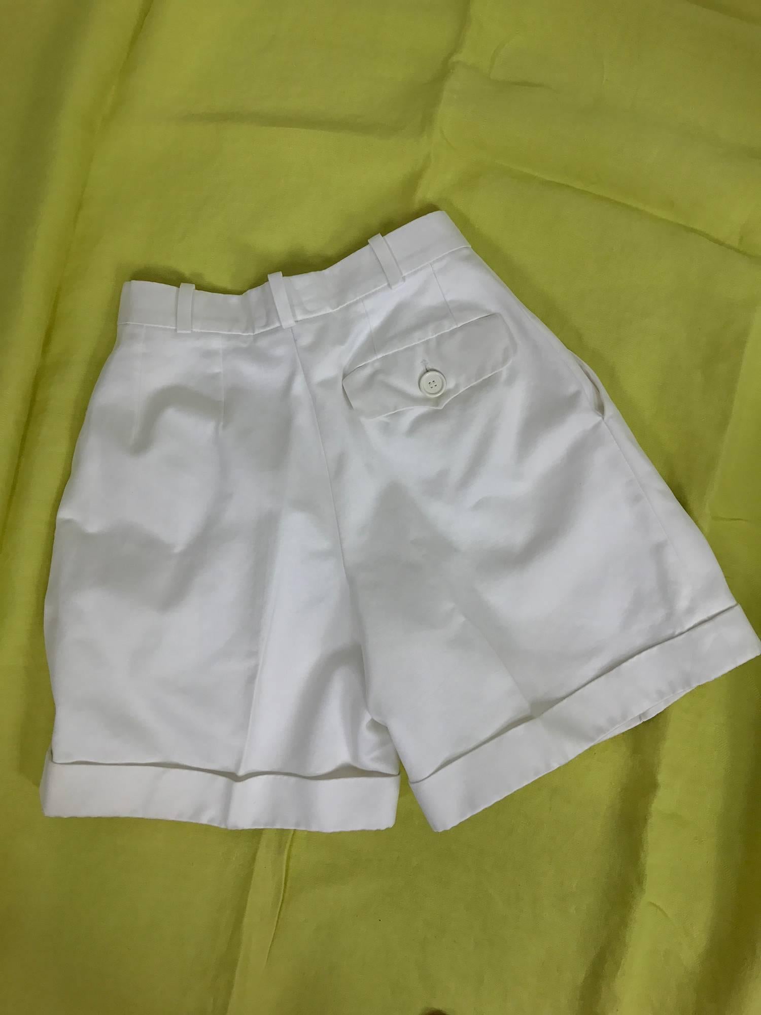 Yves Saint Laurent Rive gauche white cotton twill shorts from the 1970s...Fitted waist with belt loops, angled side pockets, single button flap back pocket...Cuffed leg...Fly front, button at the waist...Marked size 34, fits like a 2-4.

In