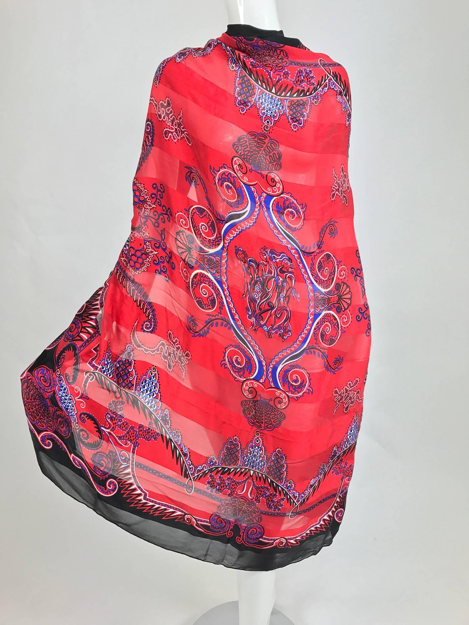Zandra Rhodes large silk scarf/shawl the chiffon is matte woven with a wide satin stripe, the ground is red with a black border and a print in purple, black and white...The center features the three graces...Signed, with tag marked silk made in