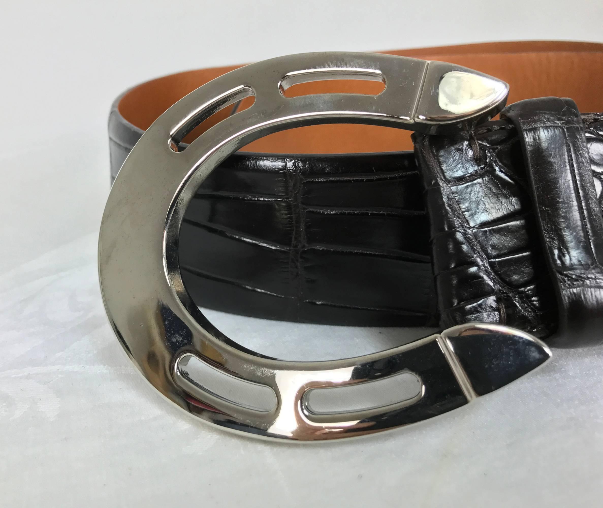 Fabulous Ralph Lauren dark chocolate brown alligator belt with a large heavy silver horseshoe buckle...Marked size Large...In excellent condition looks unworn.
Measurements are:
1 5/8" wide
40 1/2" long end to end belt only add 3 3/4"