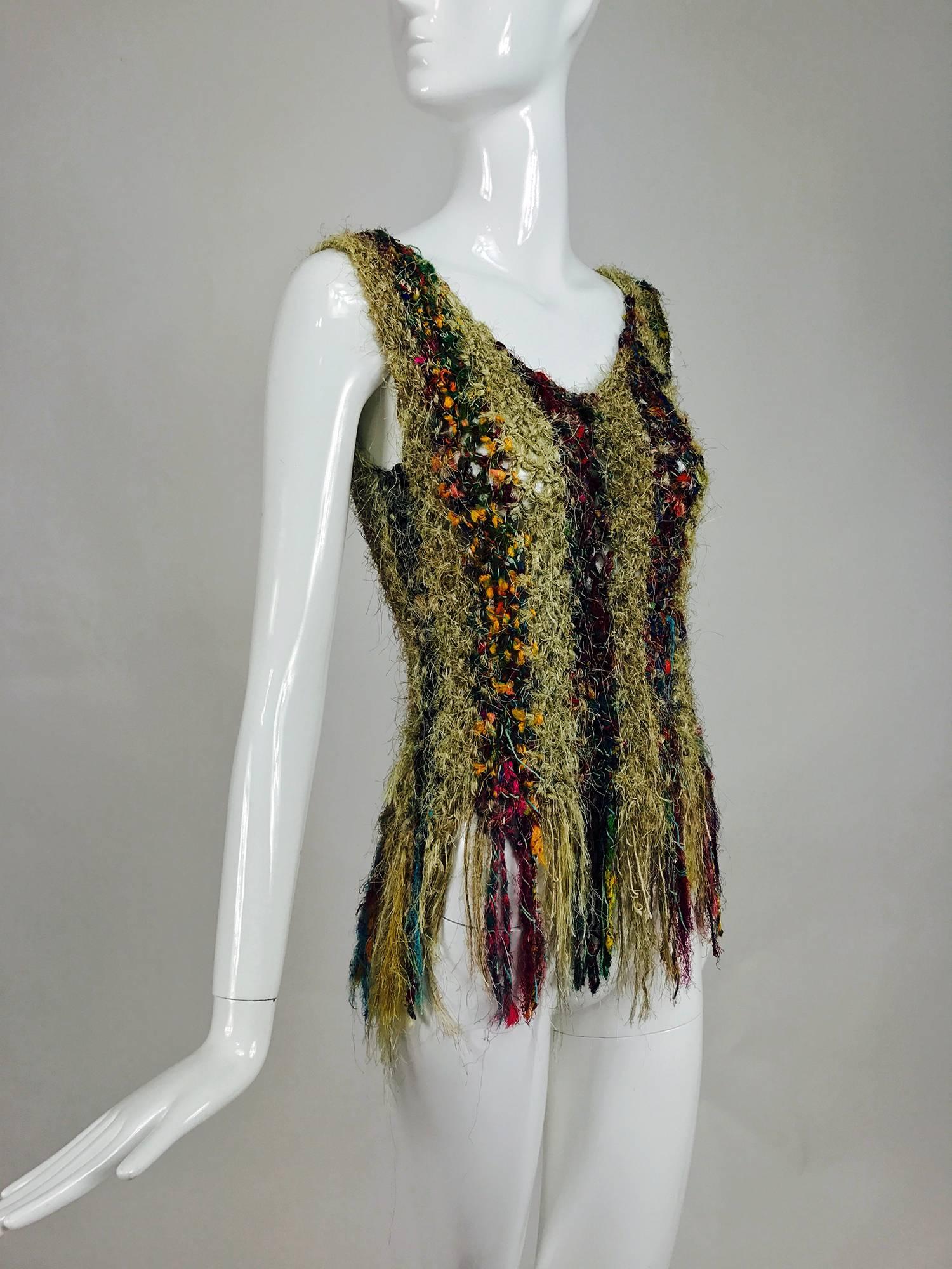 This unique hand woven top is made from multi colour silk threads, the hem features an irregular fringe...Scoop neck and fitted it is pretty amazing, with colour and texture...Fits a size small...

In excellent wearable condition... All our clothing