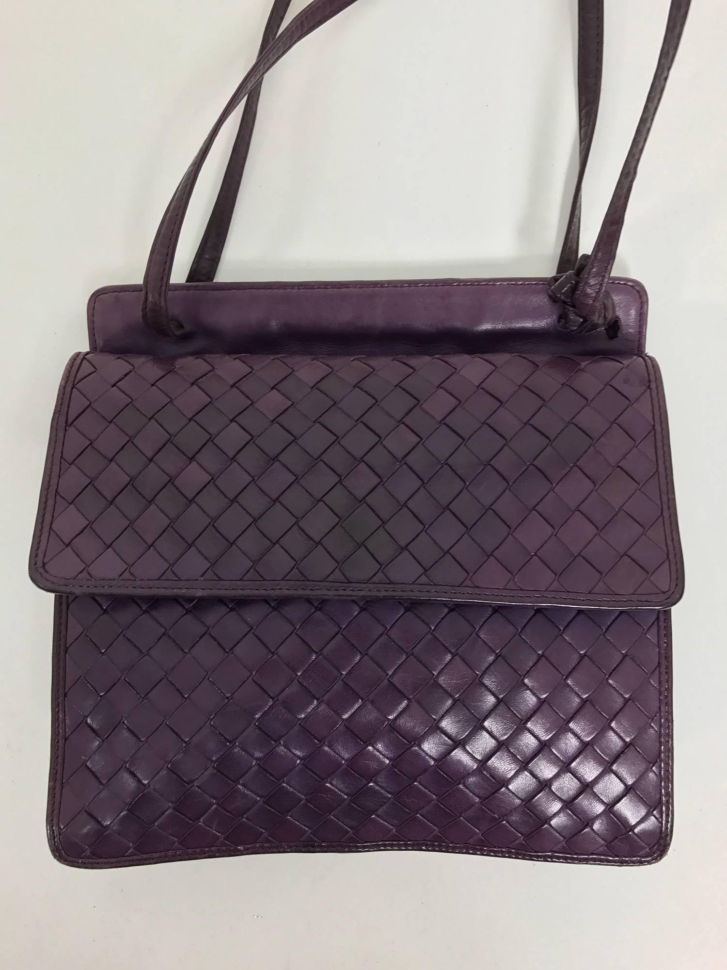 Bottega Veneta vintage 1980s intrecciato soft purple leather handbag from the 1980s...Can be carried as a shoulder bag...Flap front bag with gusseted sides and bottom...Interior features a single back side pocket with a zipper closure...The bag has