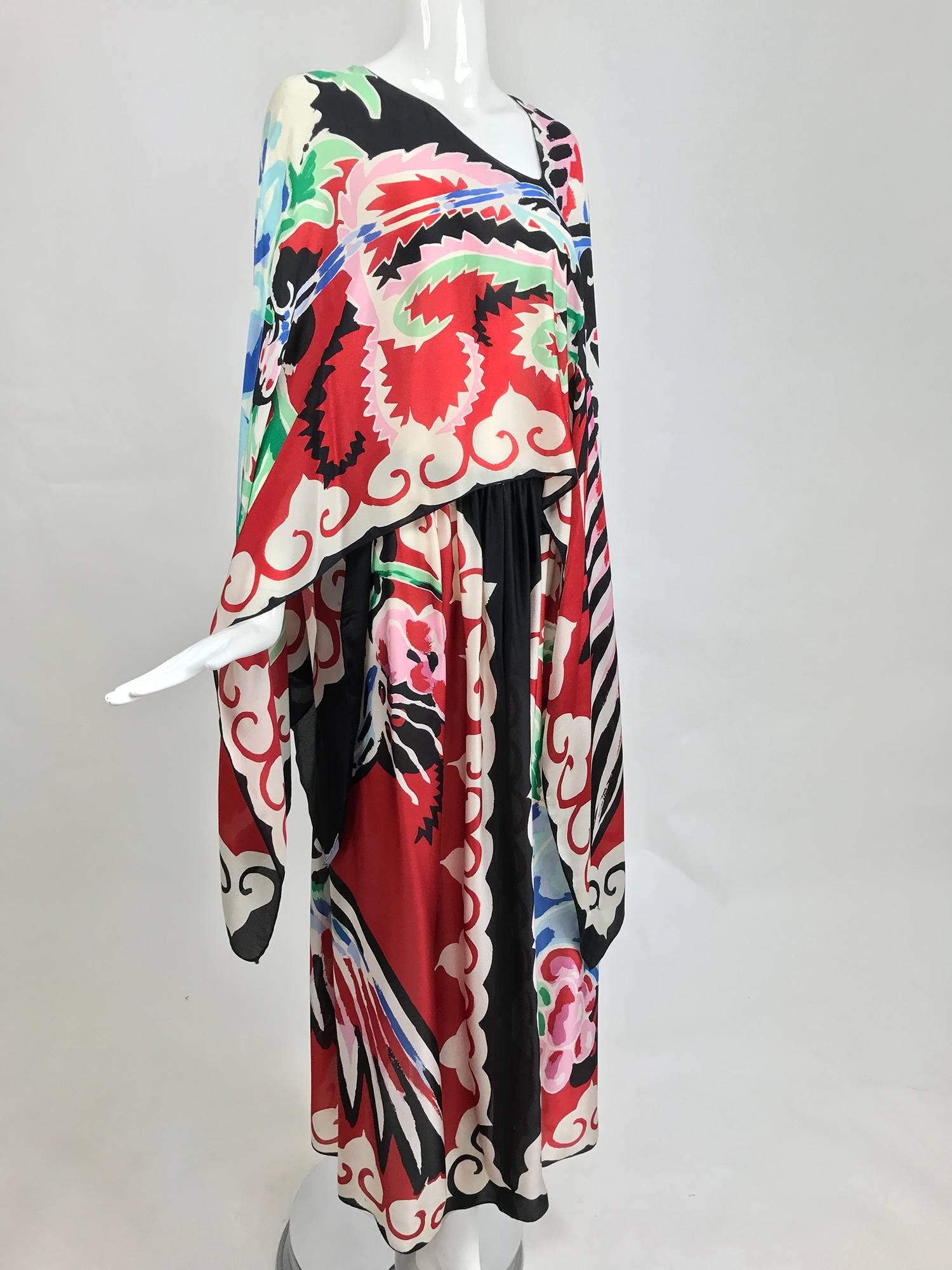 We are offering this amazing Michaele Vollbracht silk print dress which is constructed of  a cape top with attached maxi skirt...This dress, with an additional matching cape, is in the collection of the Metropolitan Museum...It's a vibrant print of
