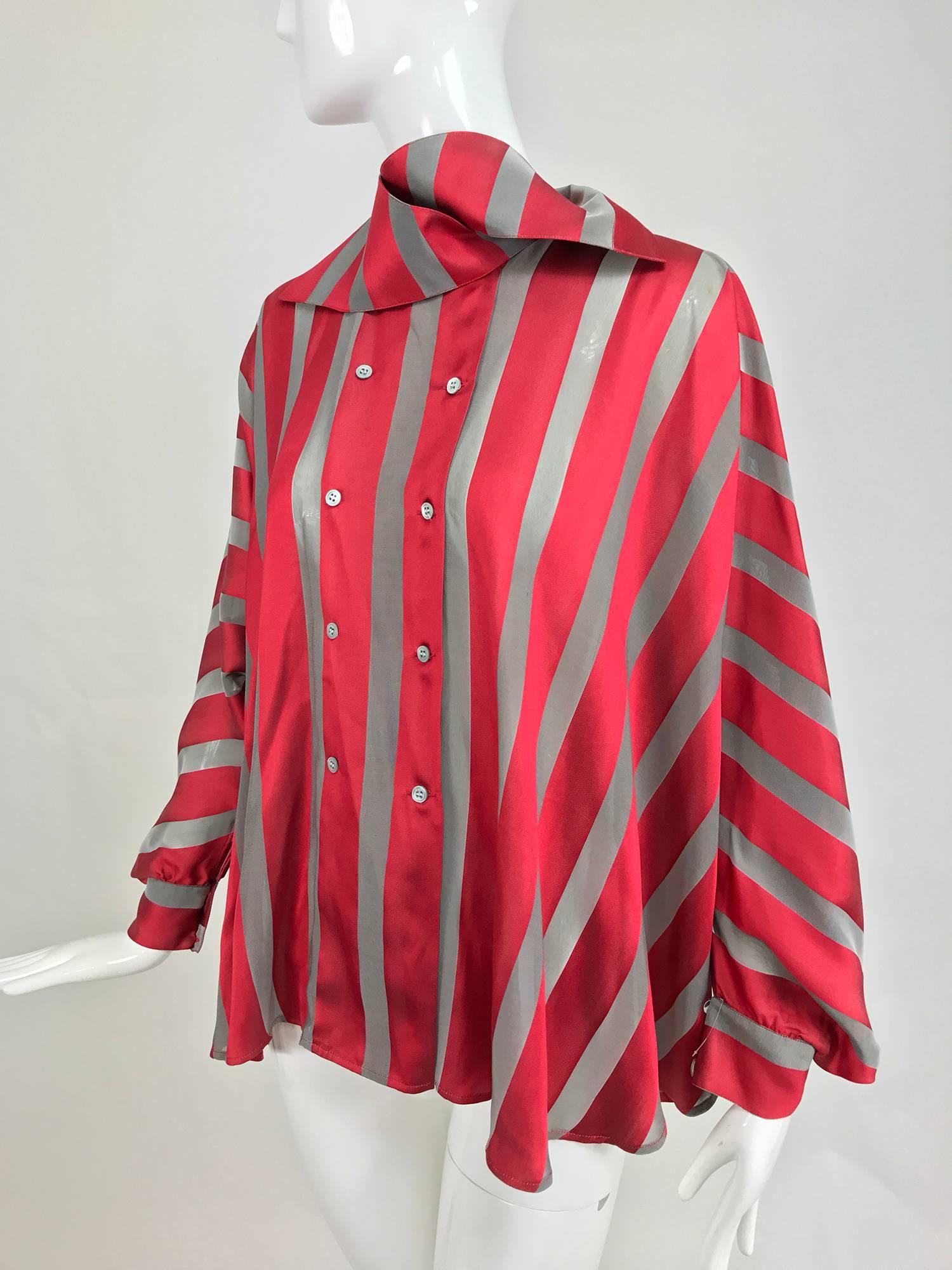 Gianfranco Ferre red and grey silk stripe unique sleeve swing blouse from the 1990s...A masterpiece of construction! This blouse features a button on wrap collar, double breasted closure at the front, the body of the blouse is full with beautiful