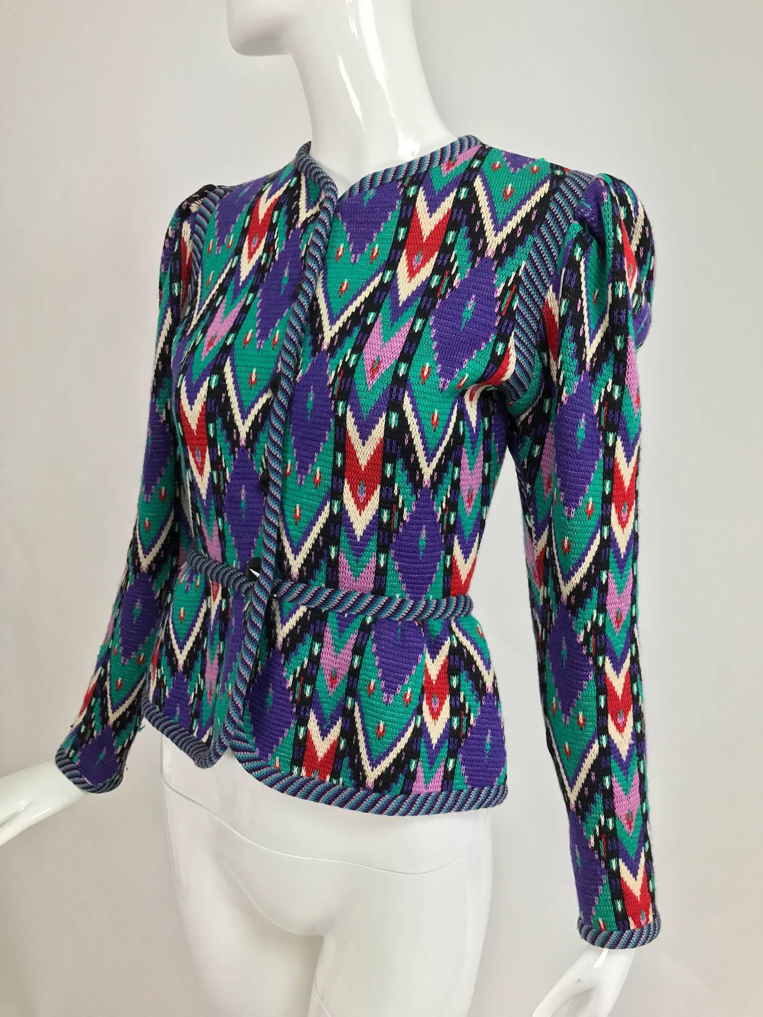 Yves Saint Laurent Rive Gauche colourful geometric knit cardigan sweater from the 1970s...Button front sweater has a coordinating diagonal knit band at the facings, shoulder, waist and hem...The sweater is fitted with peaked shoulders and long