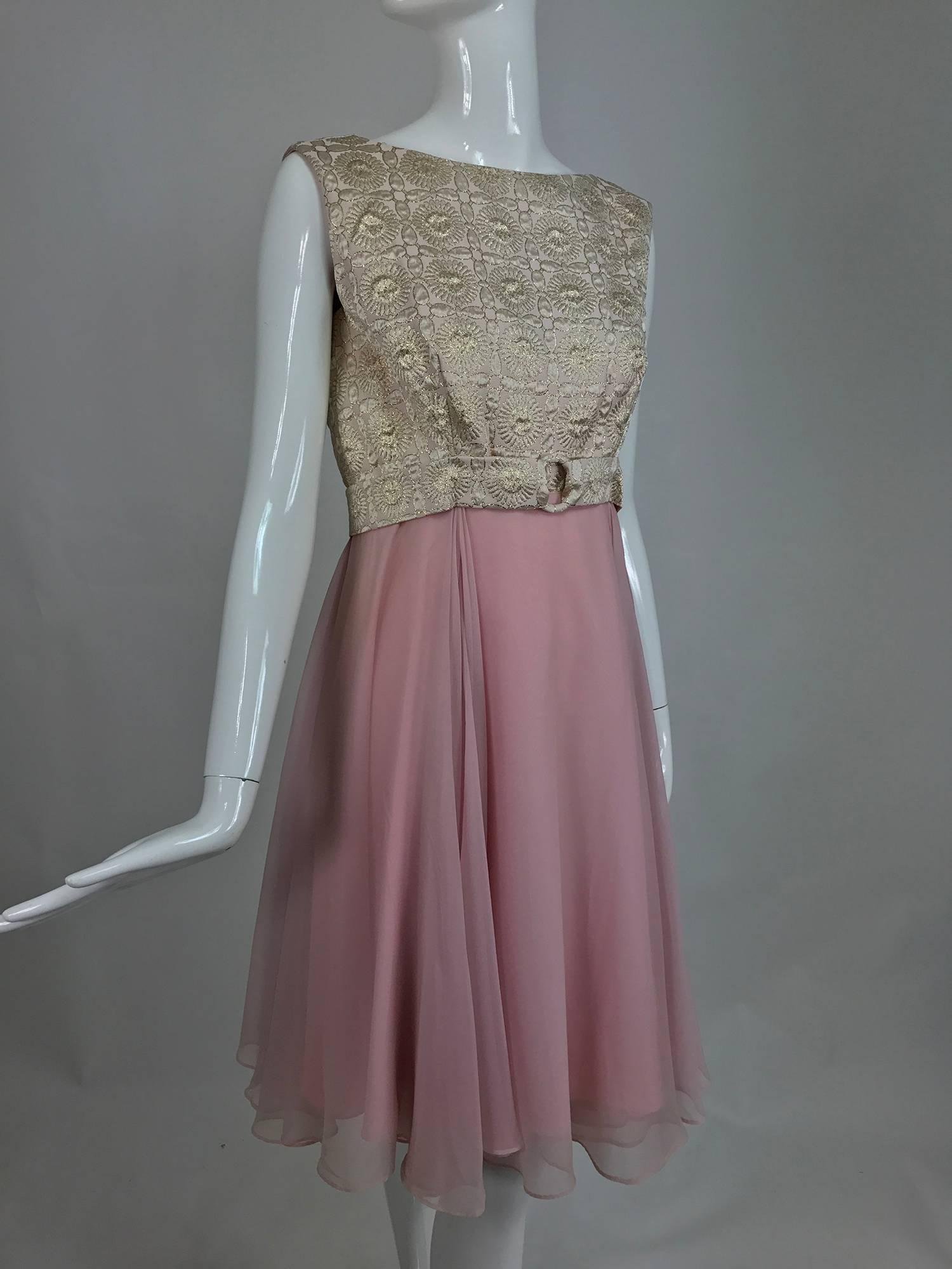 Vintage pink chiffon and gold metallic brocade cocktail dress from the 1960s...Classic early 1960s cocktail dress that is still fashionable today...The sleeveless bodice is pink and gold metallic brocade with a matching belt, the full skirt is