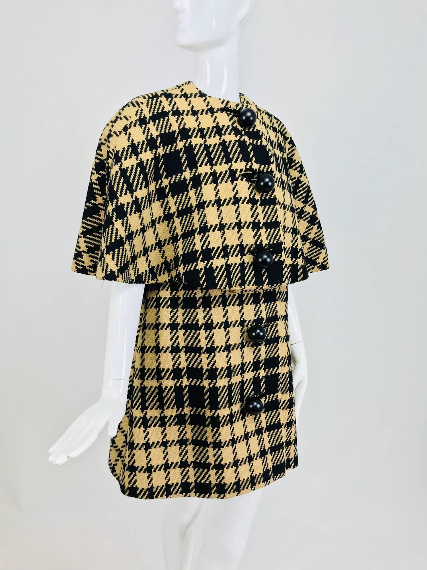 Rudi Gernreich vintage 1960s mod black and tan wool houndstooth plaid mini cape tent coat. Over sized houndstooth pattern is woven in black with a tan ground, the wool is a chunky weave. This piece has fabulous Bakelite buttons, the outer buttons