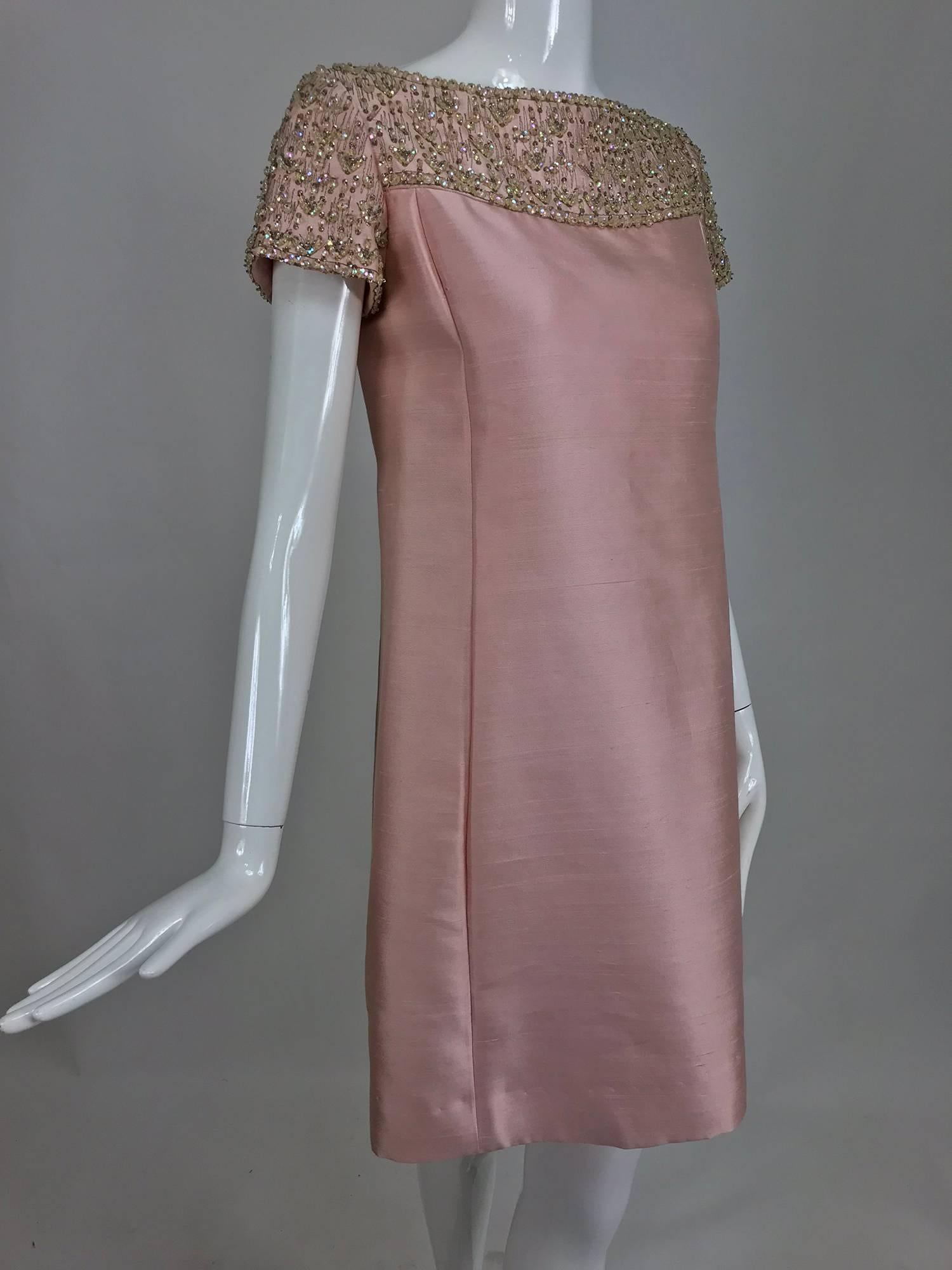 Vintage Malcolm Starr classic beaded pink silk princess seam cocktail dress from the early 1960s...A style regularity worn by Audrey Hepburn and Jackie Kennedy classic and elegant...Bateau neckline dress with upper bodice and cap sleeves covered in