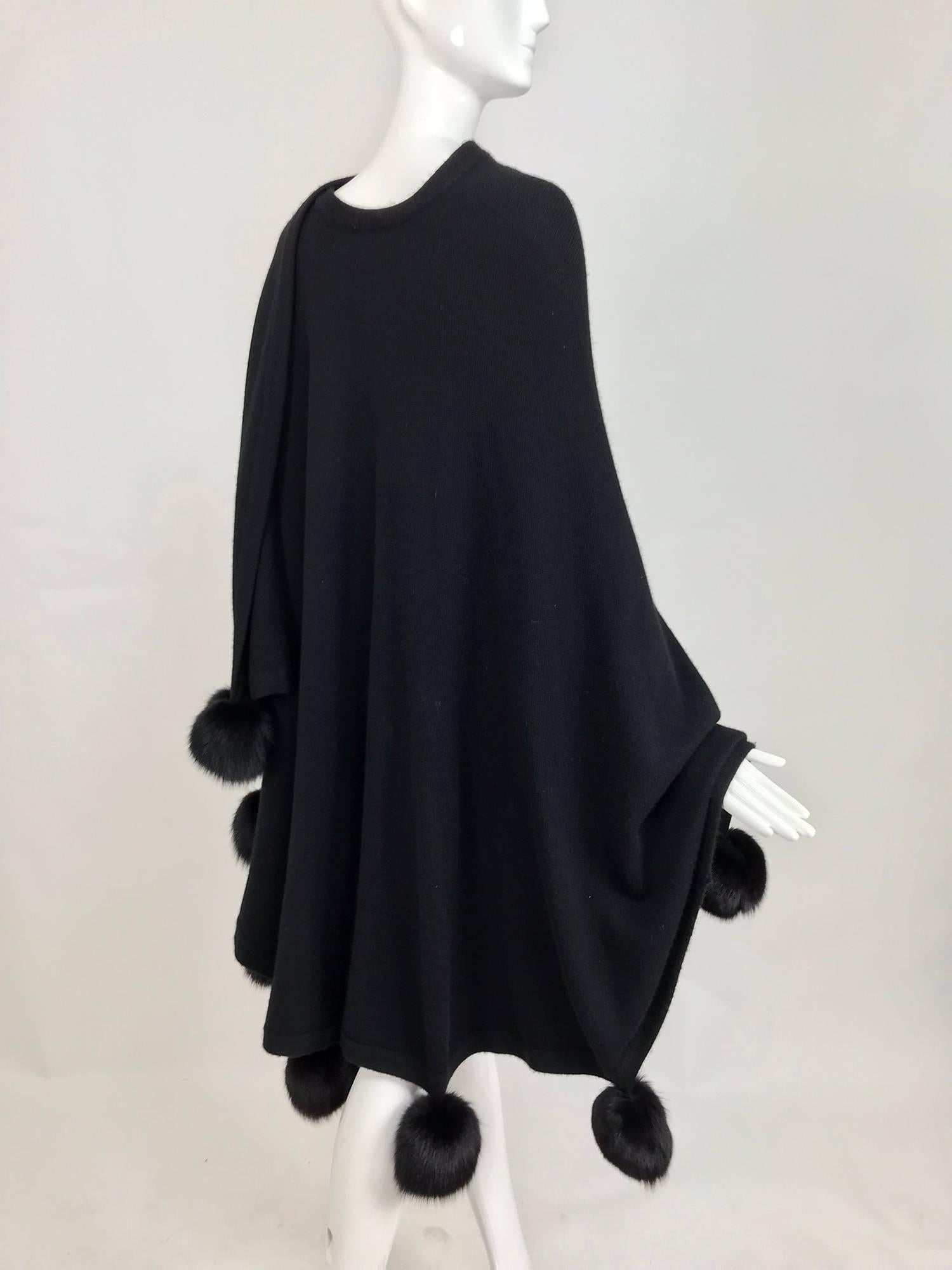 Black cashmere wool knit cape wrap with black mink pom pom trims  In Excellent Condition In West Palm Beach, FL