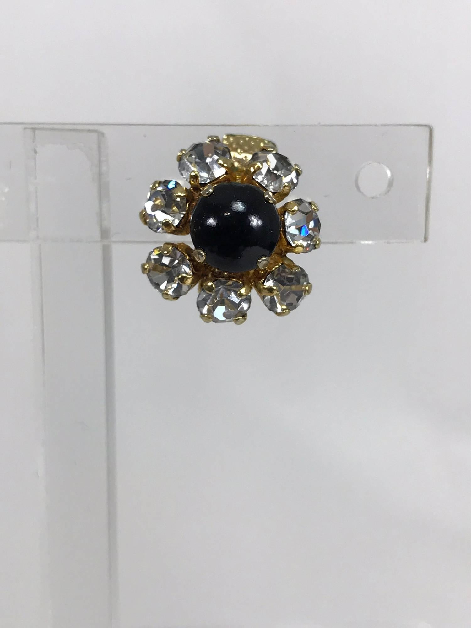 Christian Dior dainty gold earrings set with a black ball center that is surrounded with prong set rhinestones, clip backs. Marked Christian Dior Germany 1965.
Approximately 5/8