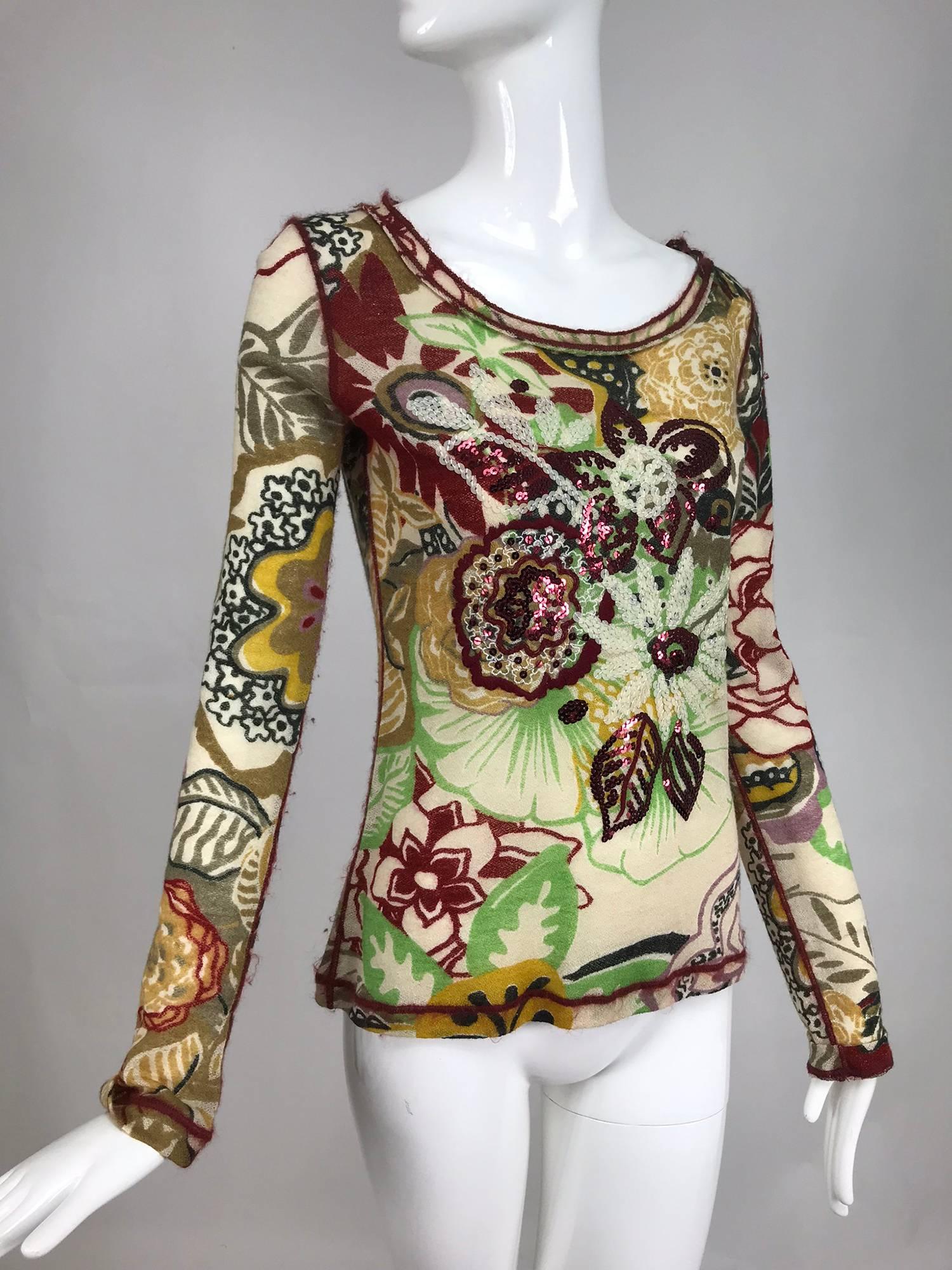 Jean Paul Gaultier Fuzzi sequin floral light lacy wool knit sweater. Pull on sheer sweater with a floral print that is over embroidered with sequins. The neck, cuffs and hem are trimmed with embroidered mohair. Marked size Medium.

 In excellent