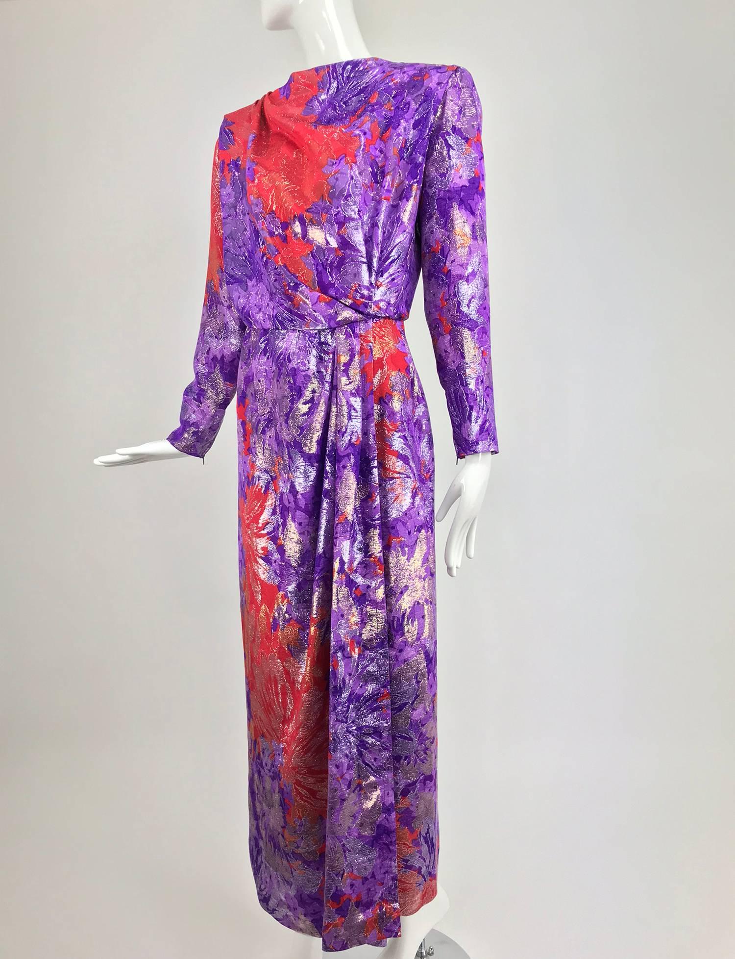 Yves Saint Laurent red and purple metallic brocade evening dress from the 1980s...Dramatic big shoulder gown with a draped bodice front and deep V back, this dramatic dress wraps and closes at the side front, the skirt is open to the hem...Long